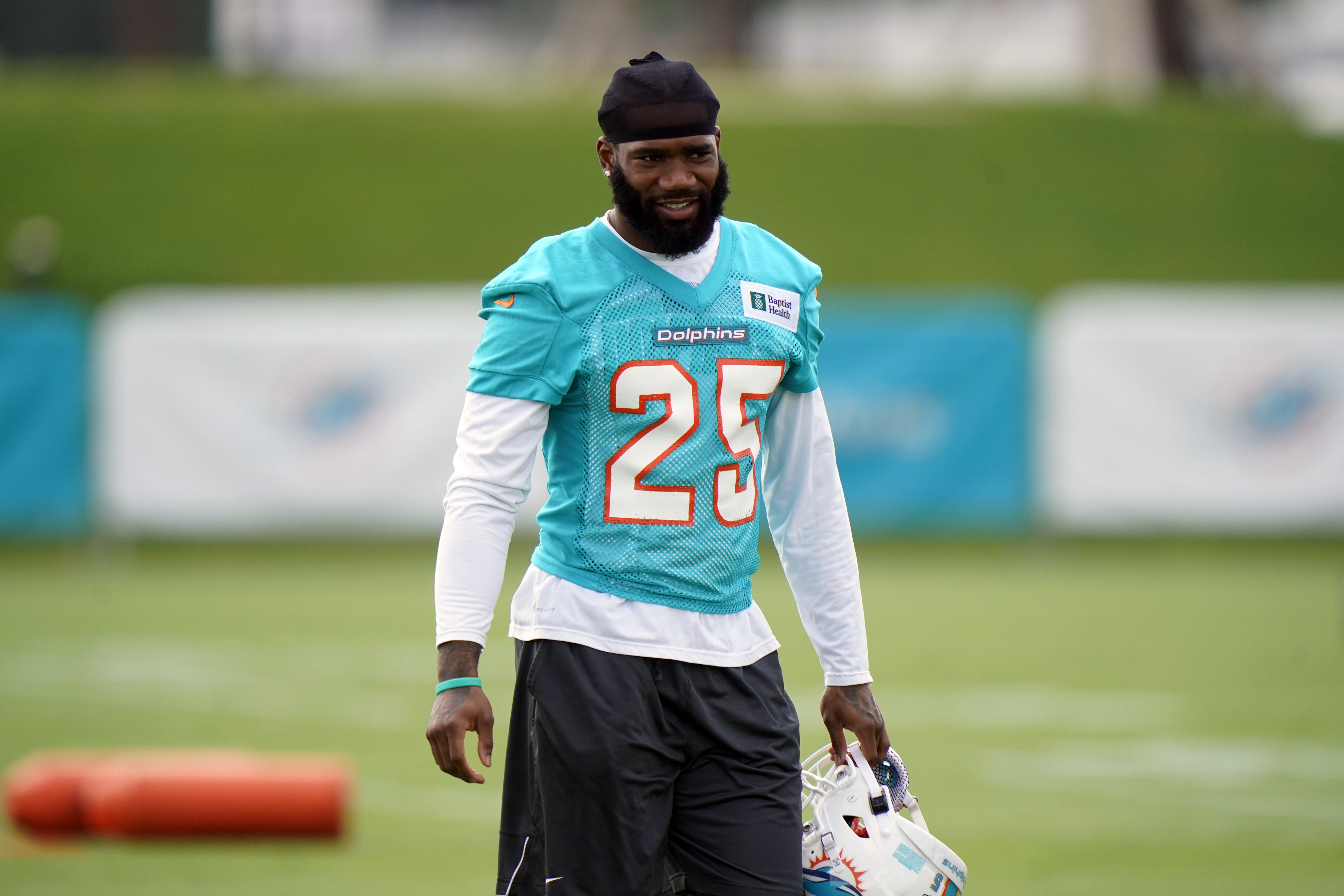 Miami Dolphins cornerback Xavien Howard prepares to warm up during NFL football practice, Wednesday, July 28, 2021, in Miami Gardens, Fla. (AP Photo/Wilfredo Lee)