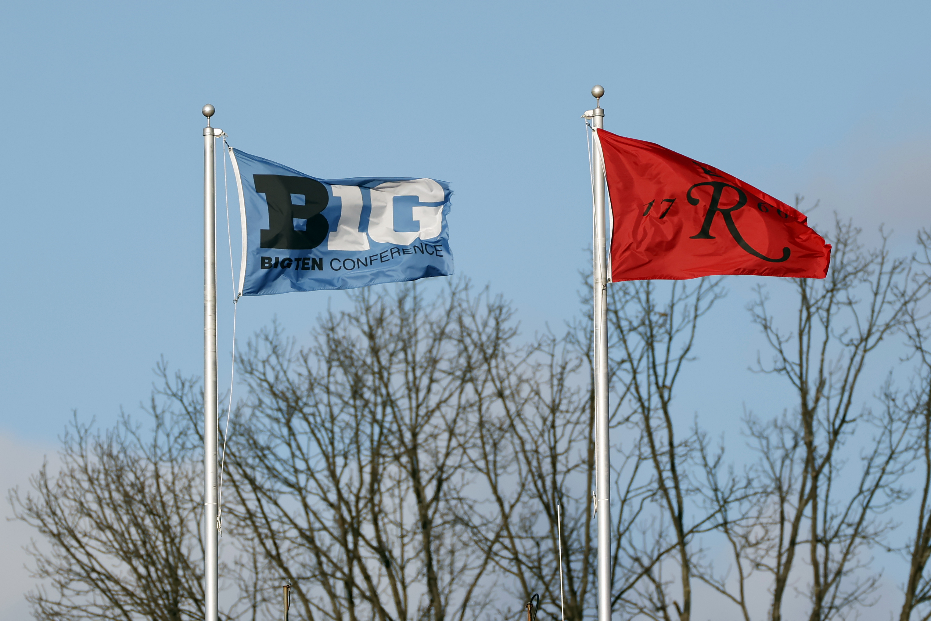 A Big Ten Conference and Rutgers flag seen flying during the second half of an NCAA college football game between Penn State and Rutgers on Saturday, Dec. 5, 2020, in Piscataway, N.J. Penn St. won 23-7. (AP Photo/Adam Hunger)