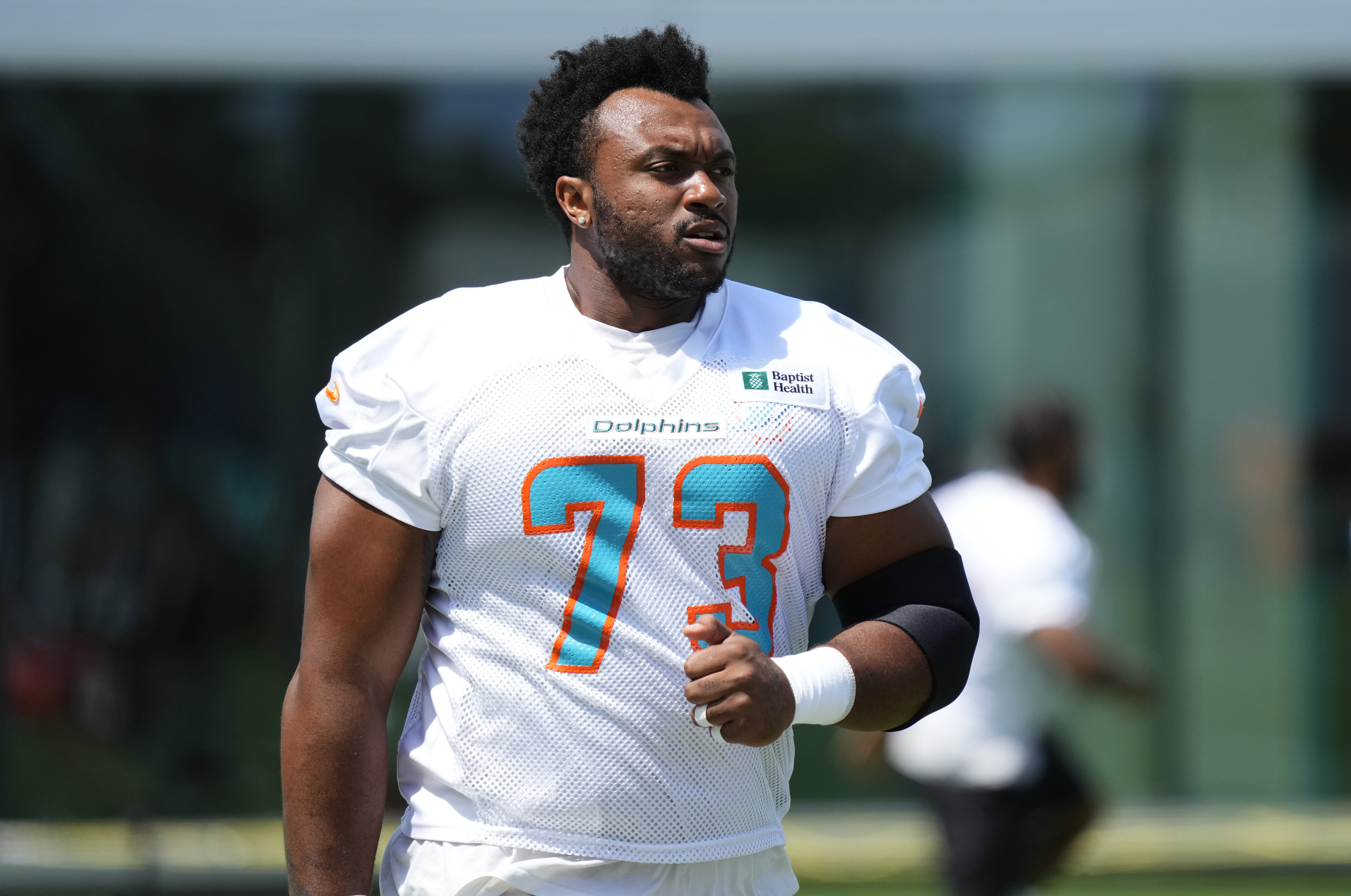 MIAMI GARDENS, FLORIDA - JULY 31: Offensive Tackle Austin Jackson #73 of the Miami Dolphins heads to the practice field during Training Camp at Baptist Health Training Complex on July 31, 2021 in Miami Gardens, Florida. (Photo by Mark Brown/Getty Images)