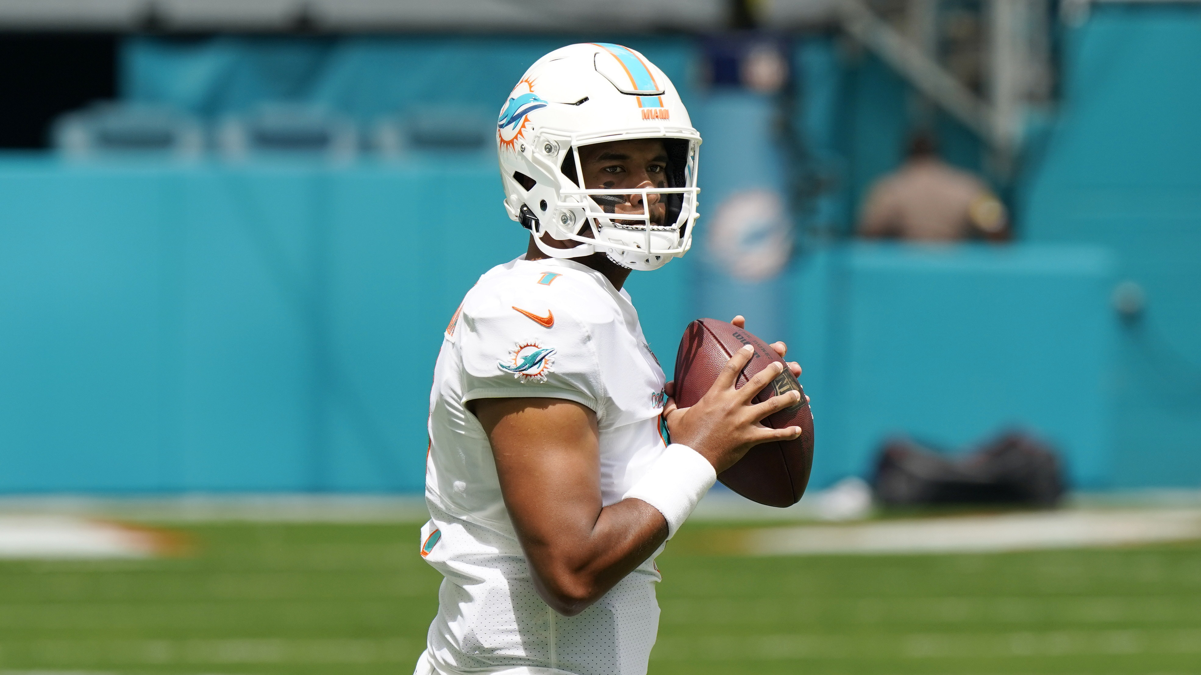 Miami Dolphins quarterback Tua Tagovailoa (1) warms before an NFL football game against the Buffalo Bills, Sunday, Sept. 19, 2021, in Miami Gardens, Fla. (AP Photo/WIlfredo Lee)