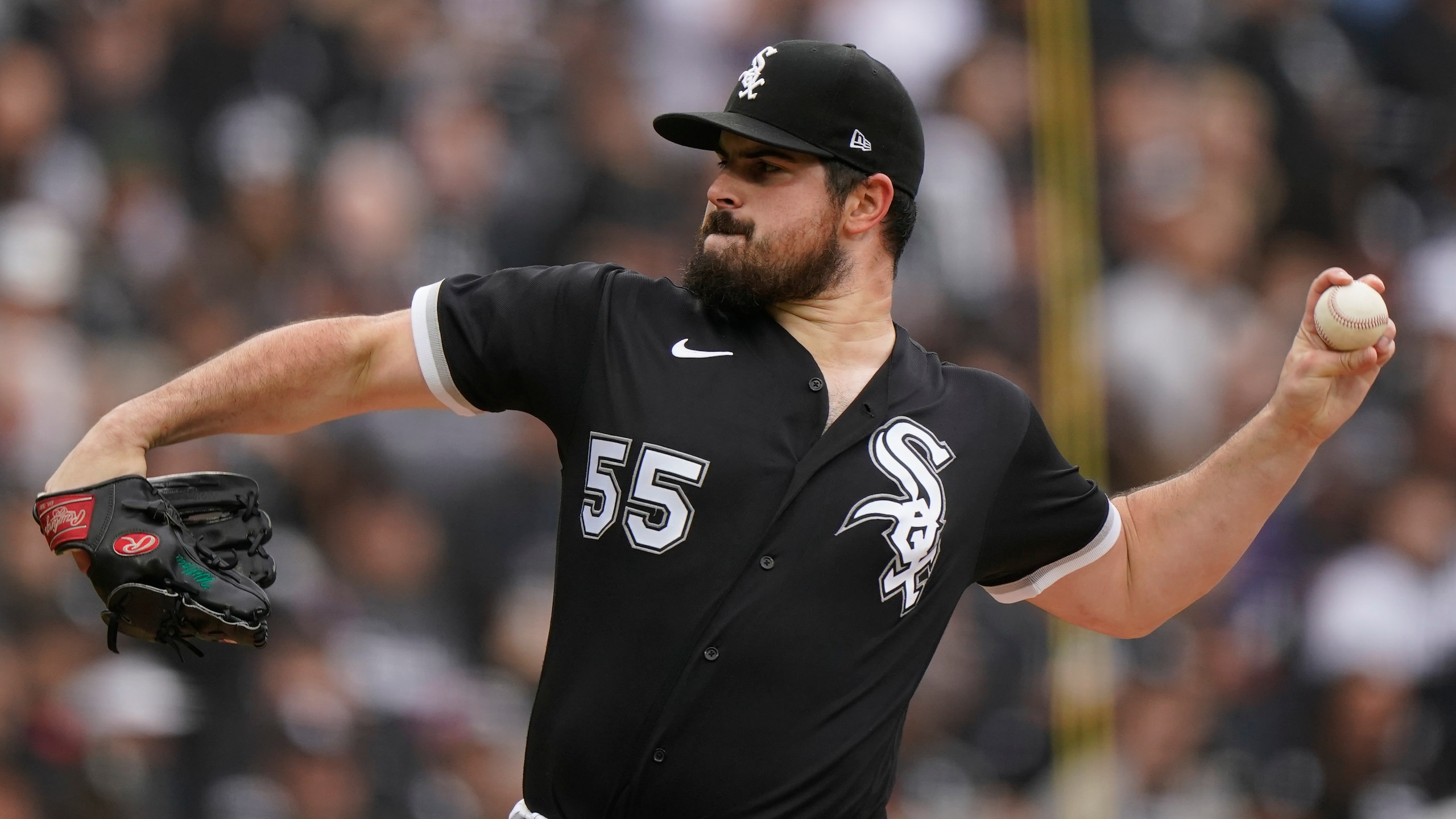 Chicago White Sox pitcher Carlos Rodon throws against the Houston Astros during Game 4 of a baseball American League Division Series Tuesday, Oct. 12, 2021, in Chicago. (AP Photo/Nam Y. Huh)