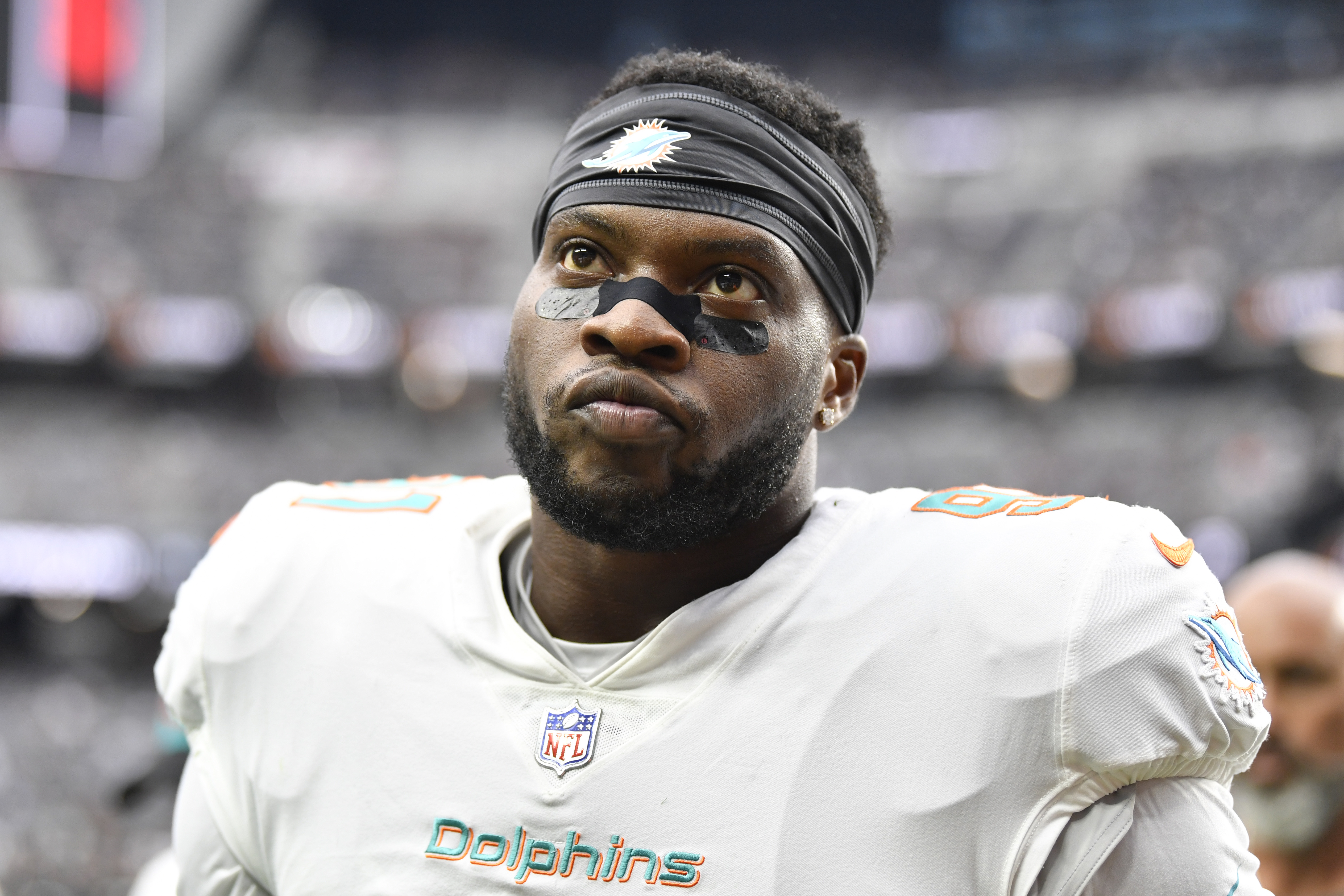 LAS VEGAS, NEVADA - SEPTEMBER 26:  Defensive end Emmanuel Ogbah #91 of the Miami Dolphins walks off the field after warmups before a game against the Las Vegas Raiders at Allegiant Stadium on September 26, 2021 in Las Vegas, Nevada. The Raiders defeated the Dolphins 31-28 in overtime. (Photo by Chris Unger/Getty Images)