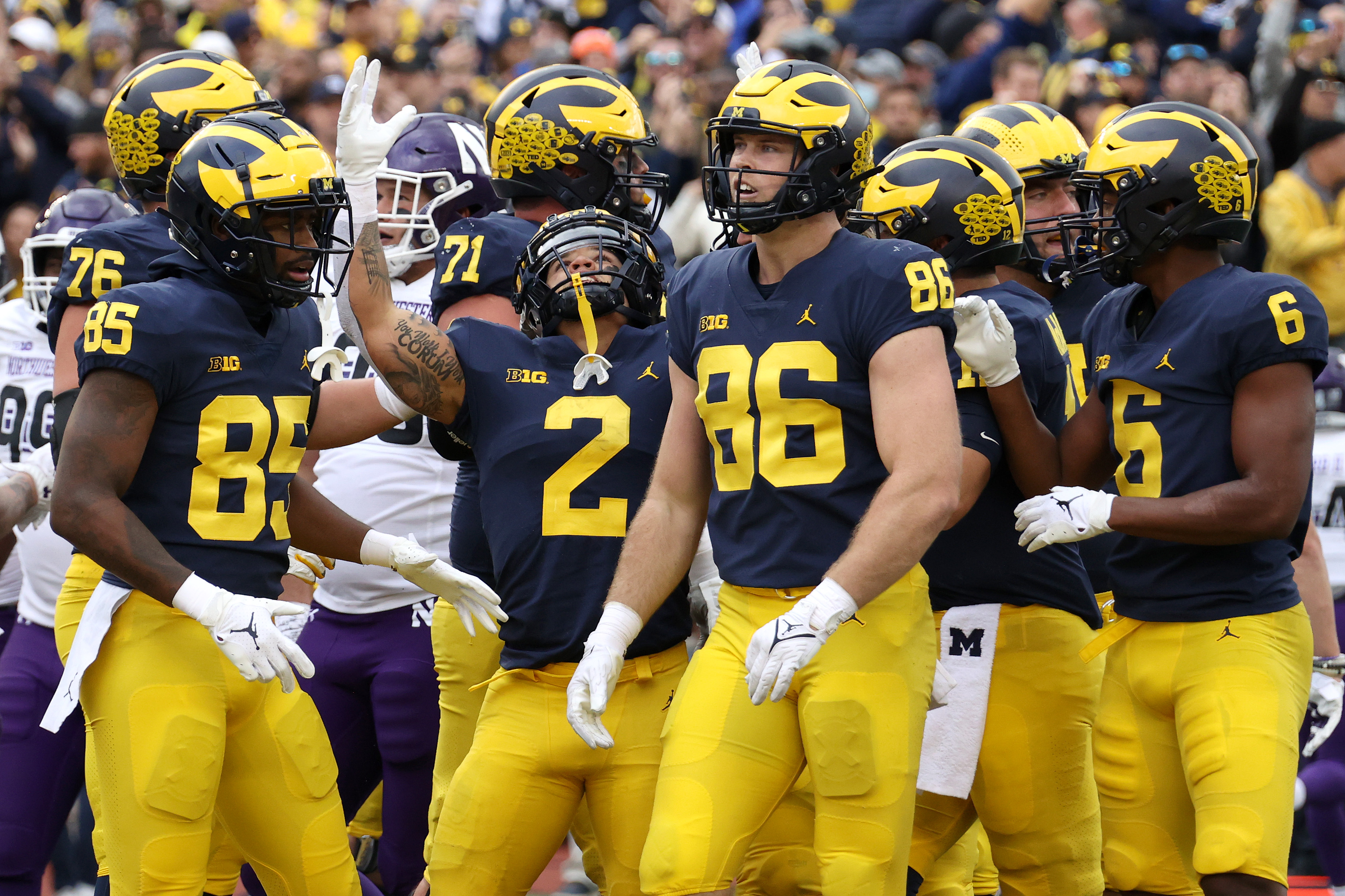 ANN ARBOR, MICHIGAN - OCTOBER 23: Blake Corum #2 of the Michigan Wolverines celebrates a first half touchdown with teammates while playing the Northwestern Wildcats at Michigan Stadium on October 23, 2021 in Ann Arbor, Michigan. (Photo by Gregory Shamus/Getty Images)