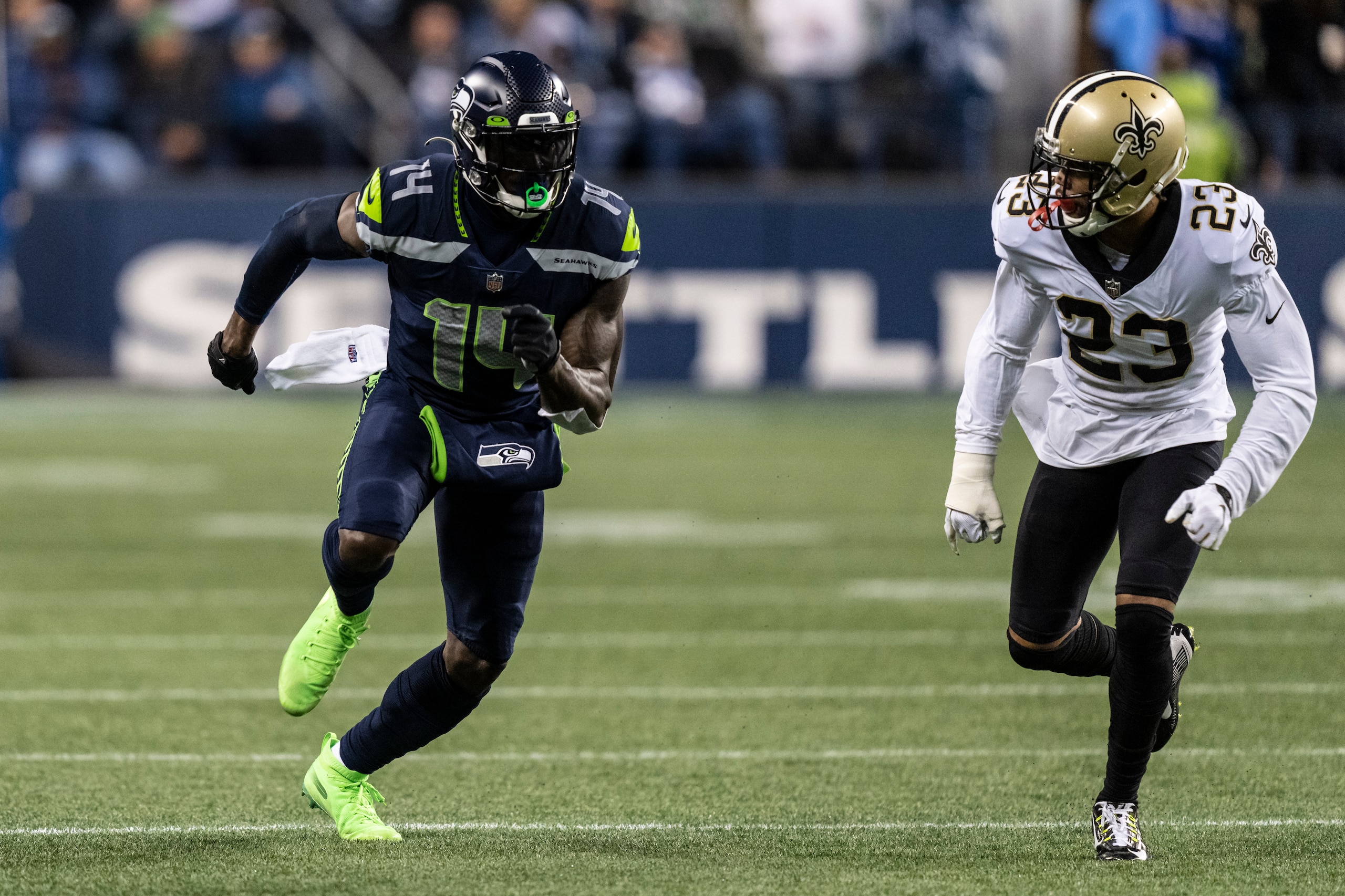 Seattle Seahawks wide receiver DK Metcalf, left, is covered by New Orleans Saints defensive back Marshon Lattimore durring an NFL football game, Monday, Oct. 25, 2021, in Seattle. The Saints won 13-10. (AP Photo/Stephen Brashear)