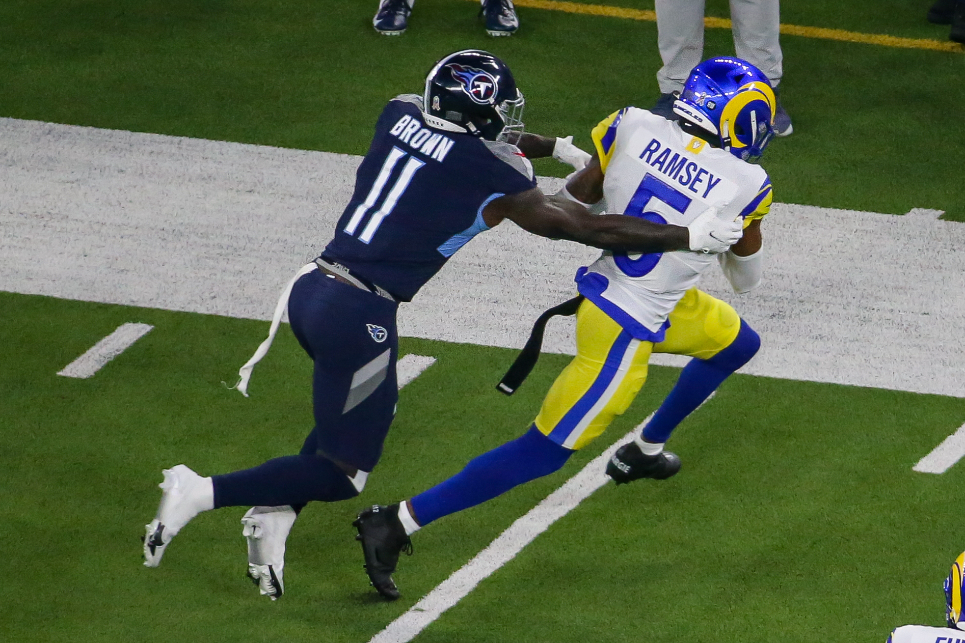 Los Angeles Rams cornerback Jalen Ramsey (5) intercepts a pass attended for  Tennessee Titans wide receiver A.J. Brown (11) during a NFL game, Sunday,  Nov. 7, 2021, in Inglewood, the Titans defeated