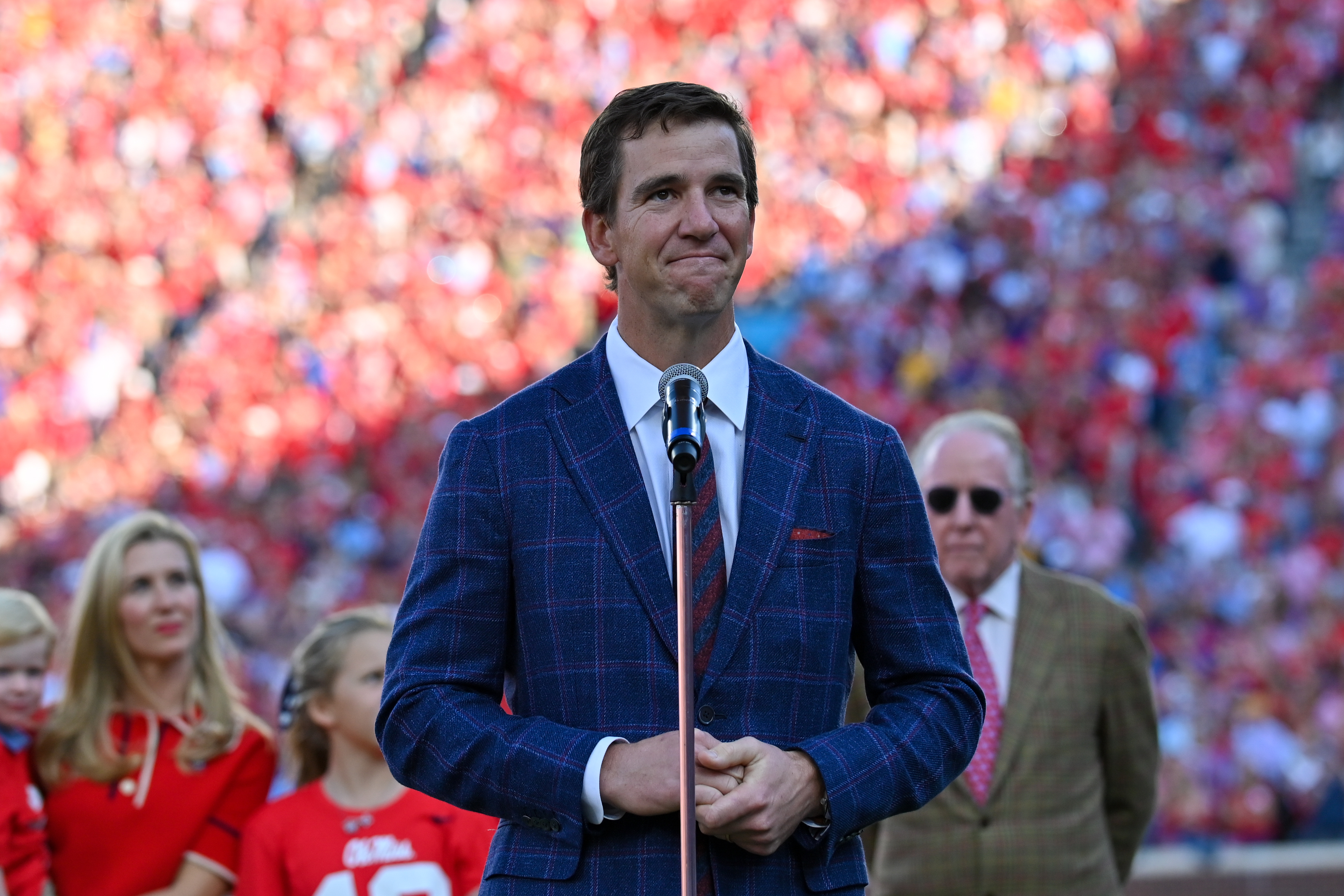 Eli takes picture with fan wearing 'Double Bird' jersey