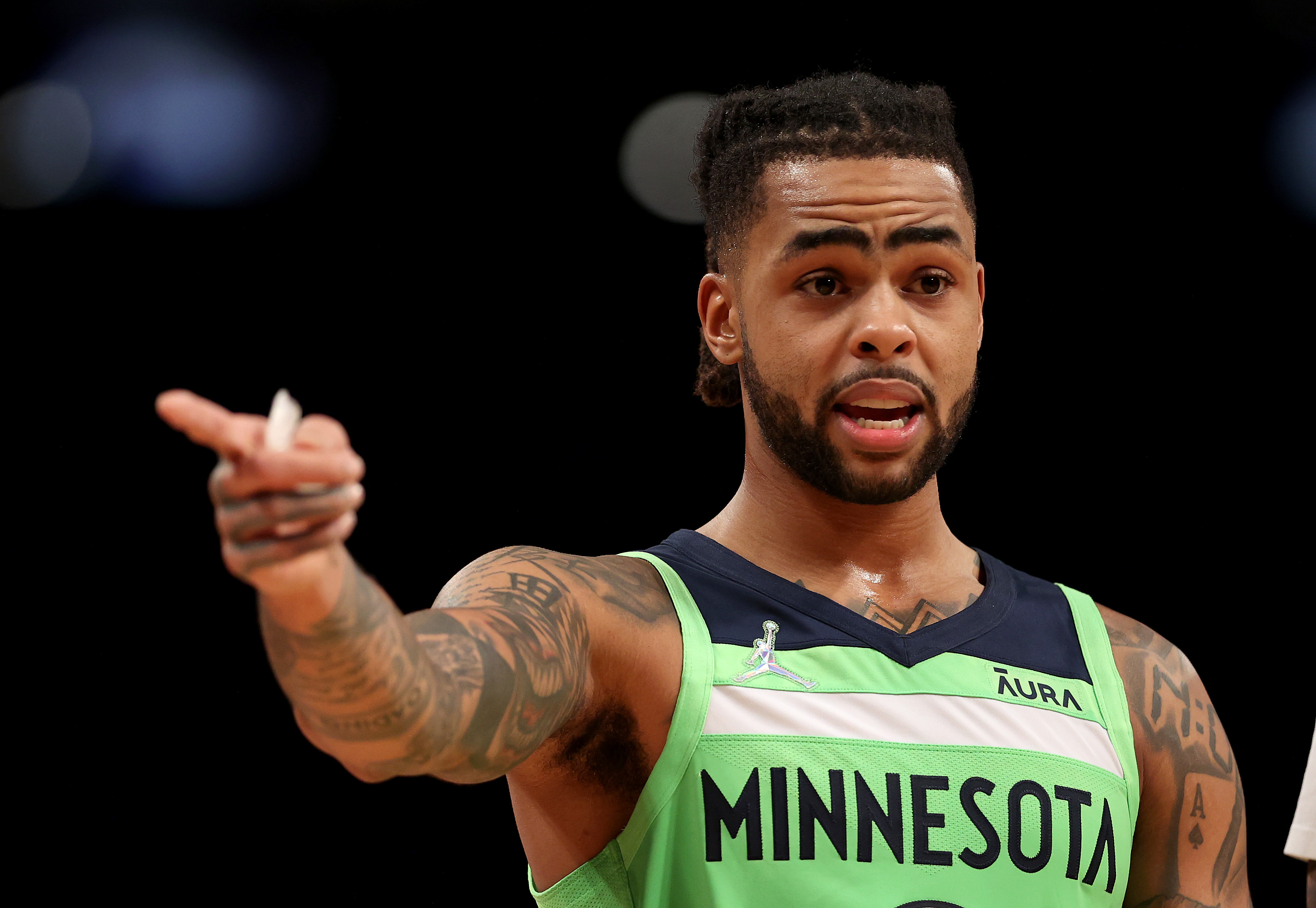 NEW YORK, NEW YORK - DECEMBER 03:  D'Angelo Russell #0 of the Minnesota Timberwolves directs his teammates in the first half against the Brooklyn Nets at Barclays Center on December 03, 2021 in the Brooklyn borough of New York City. NOTE TO USER: User expressly acknowledges and agrees that, by downloading and or using this photograph, User is consenting to the terms and conditions of the Getty Images License Agreement. (Photo by Elsa/Getty Images)