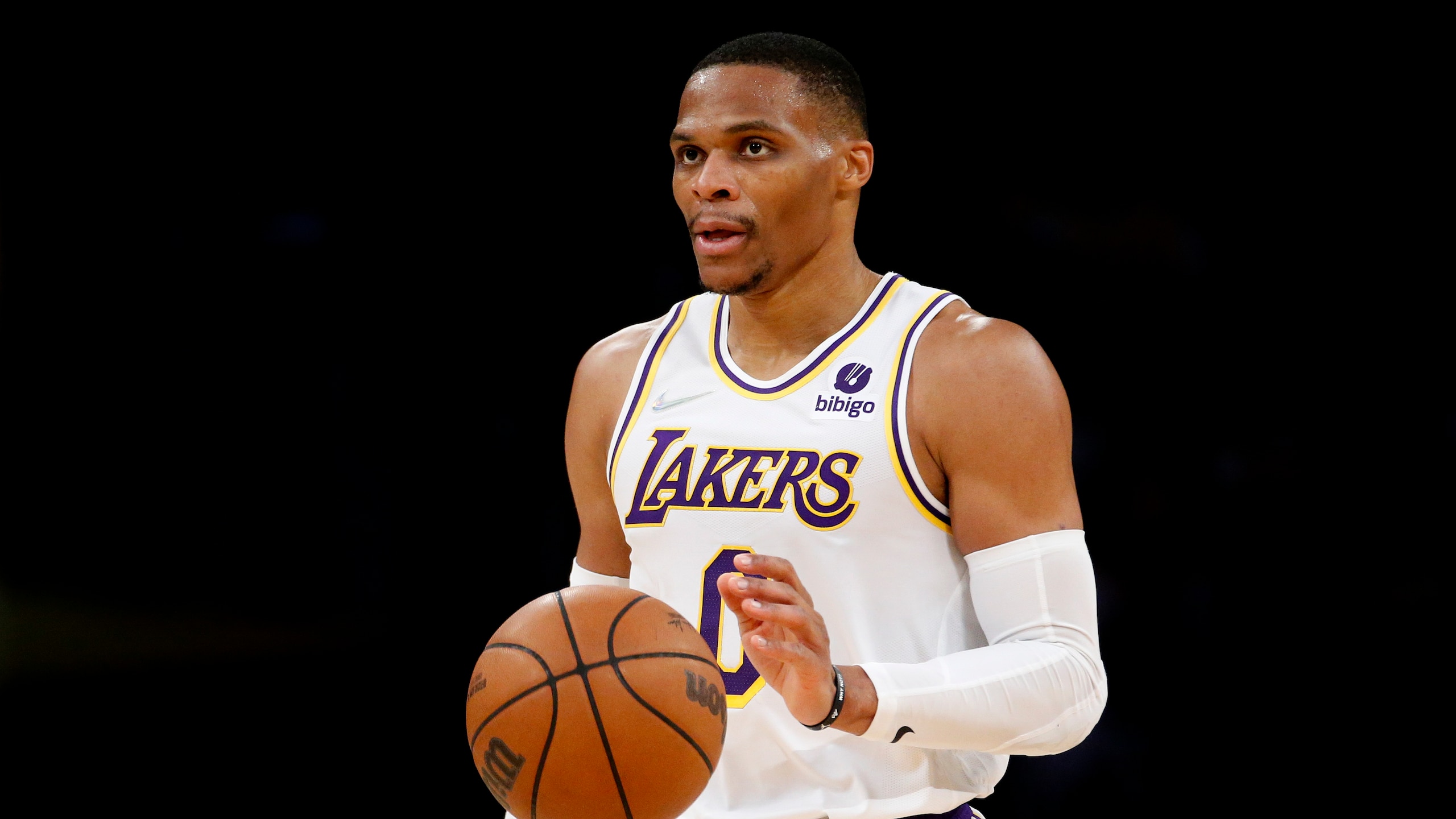 Los Angeles Lakers guard Russell Westbrook (0) dribbles against the Orlando Magic during the second half of an NBA basketball game in Los Angeles, Sunday, Dec. 12, 2021. The Lakers won 106-94. (AP Photo/Ringo H.W. Chiu)