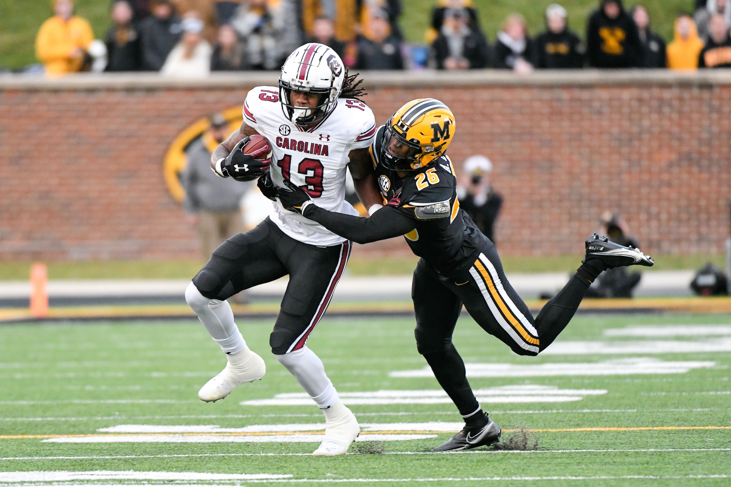 COLUMBIA, MO - NOVEMBER 13: South Carolina Gamecocks wide receiver E.J. Jenkins (13) cant get away from the tackle by Missouri Tigers defensive back Akayleb Evans (26) during a game between the South Carolina Gamecocks and the Missouri Tigers on November 13, 2021, at Faurot Field at Memorial Stadium in Columbia MO (Photo by Rick Ulreich/Icon Sportswire via Getty Images) COLUMBIA, MO - NOVEMBER 13: South Carolina Gamecocks wide receiver E.J. Jenkins (13) cant get away from the tackle by Missouri Tigers defensive back Akayleb Evans (26) during a game between the South Carolina Gamecocks and the Missouri Tigers on November 13, 2021, at Faurot Field at Memorial Stadium in Columbia MO (Photo by Rick Ulreich/Icon Sportswire via Getty Images)