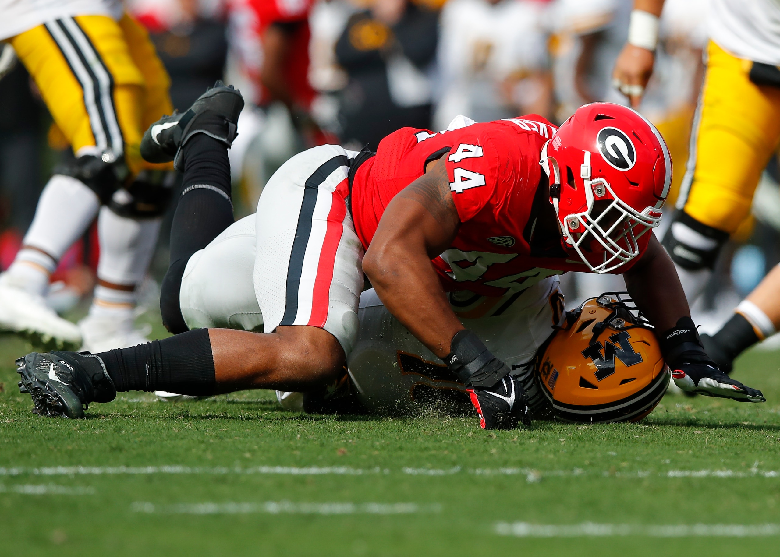 ATHENS, GA - NOVEMBER 06: Travon Walker #44 of the Georgia Bulldogs sacks Tyler Macon #10 of the Missouri Tigers in the second half at Sanford Stadium on November 6, 2021 in Athens, Georgia. (Photo by Todd Kirkland/Getty Images)