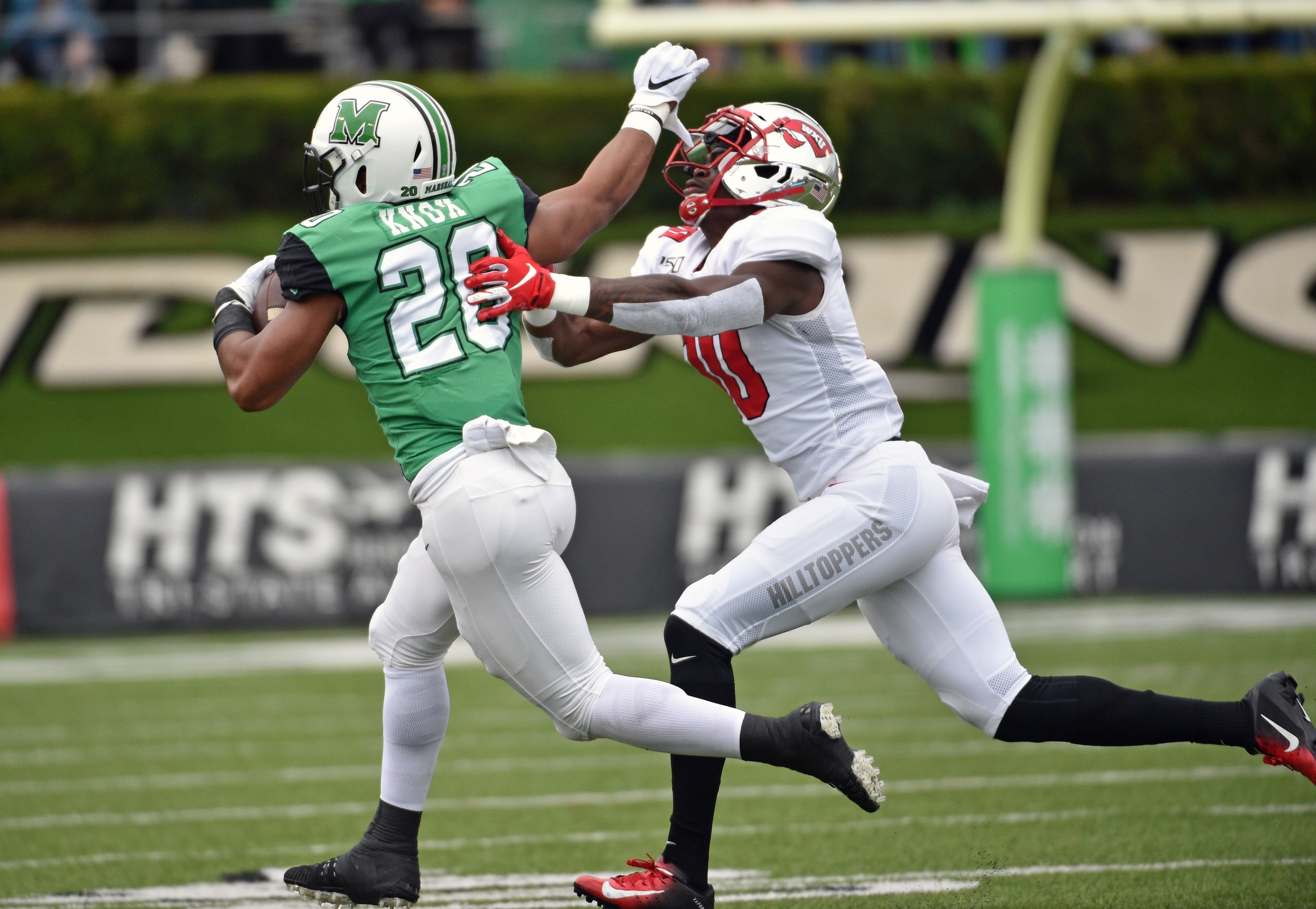 HUNTINGTON, WV - OCTOBER 26: Marshall Thundering Herd running back Joseph Early (26) stiff arms Western Kentucky Hilltoppers defensive lineman DeAngelo Malone (10) during a college football game between the Western Kentucky Hilltoppers and the Marshall Thundering Herd on October 26, 2019 at Joan C. Edwards Stadium in Huntington, WV. (Photo by Steve Roberts/Icon Sportswire via Getty Images) HUNTINGTON, WV - OCTOBER 26: Marshall Thundering Herd running back Joseph Early (26) stiff arms Western Kentucky Hilltoppers defensive lineman DeAngelo Malone (10) during a college football game between the Western Kentucky Hilltoppers and the Marshall Thundering Herd on October 26, 2019 at Joan C. Edwards Stadium in Huntington, WV. (Photo by Steve Roberts/Icon Sportswire via Getty Images)