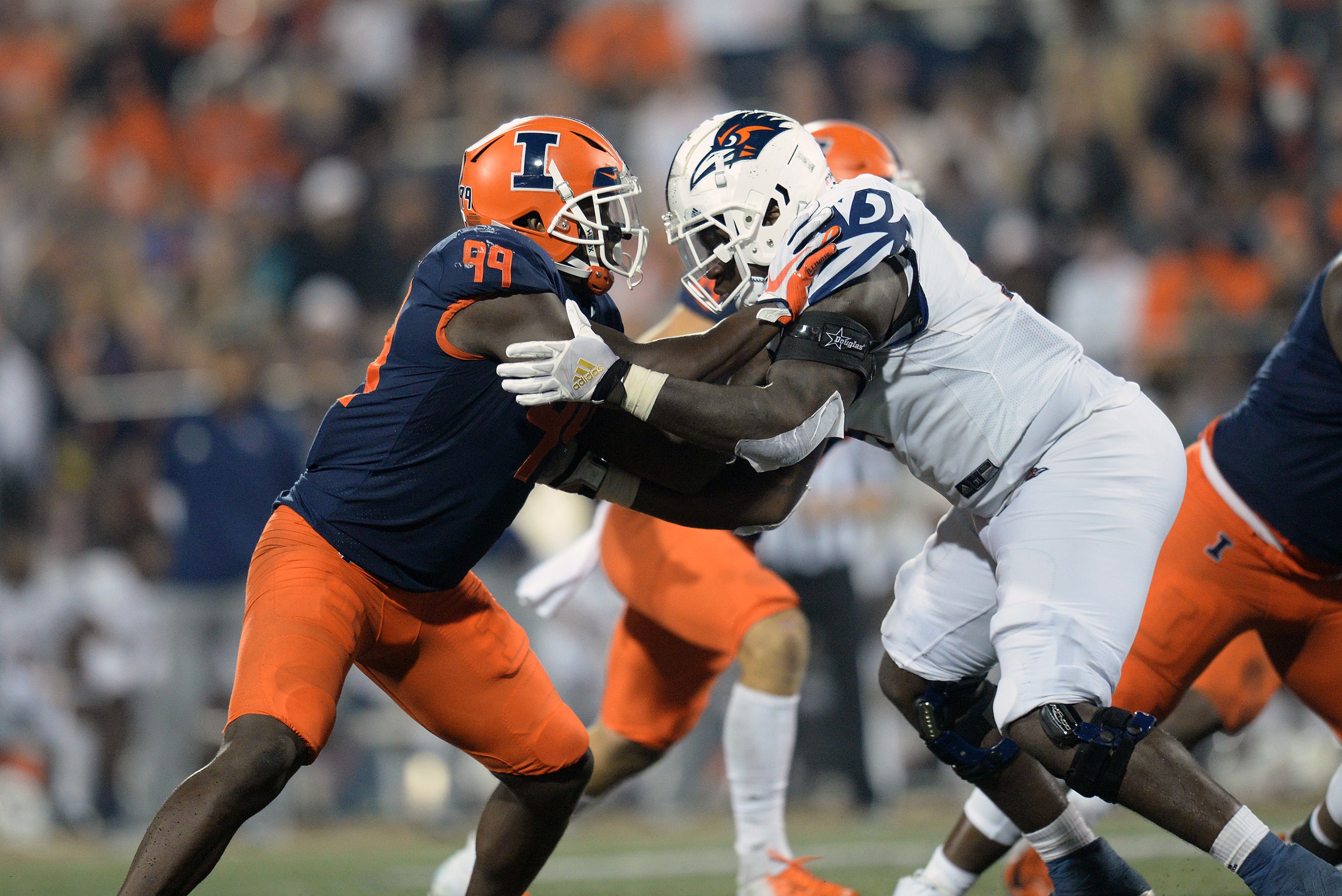 CHAMPAIGN, IL - SEPTEMBER 04: UTSA Roadrunners offensive lineman Spencer Burford (74) blocks Illinois Fighting Illini outside linebacker Owen Carney Jr. (99) during the college football game between the UTSA Roadrunners and the Illinois Fighting Illini on September 4, 2021, at Memorial Stadium in Champaign, Illinois. (Photo by Michael Allio/Icon Sportswire via Getty Images) CHAMPAIGN, IL - SEPTEMBER 04: UTSA Roadrunners offensive lineman Spencer Burford (74) blocks Illinois Fighting Illini outside linebacker Owen Carney Jr. (99) during the college football game between the UTSA Roadrunners and the Illinois Fighting Illini on September 4, 2021, at Memorial Stadium in Champaign, Illinois. (Photo by Michael Allio/Icon Sportswire via Getty Images)