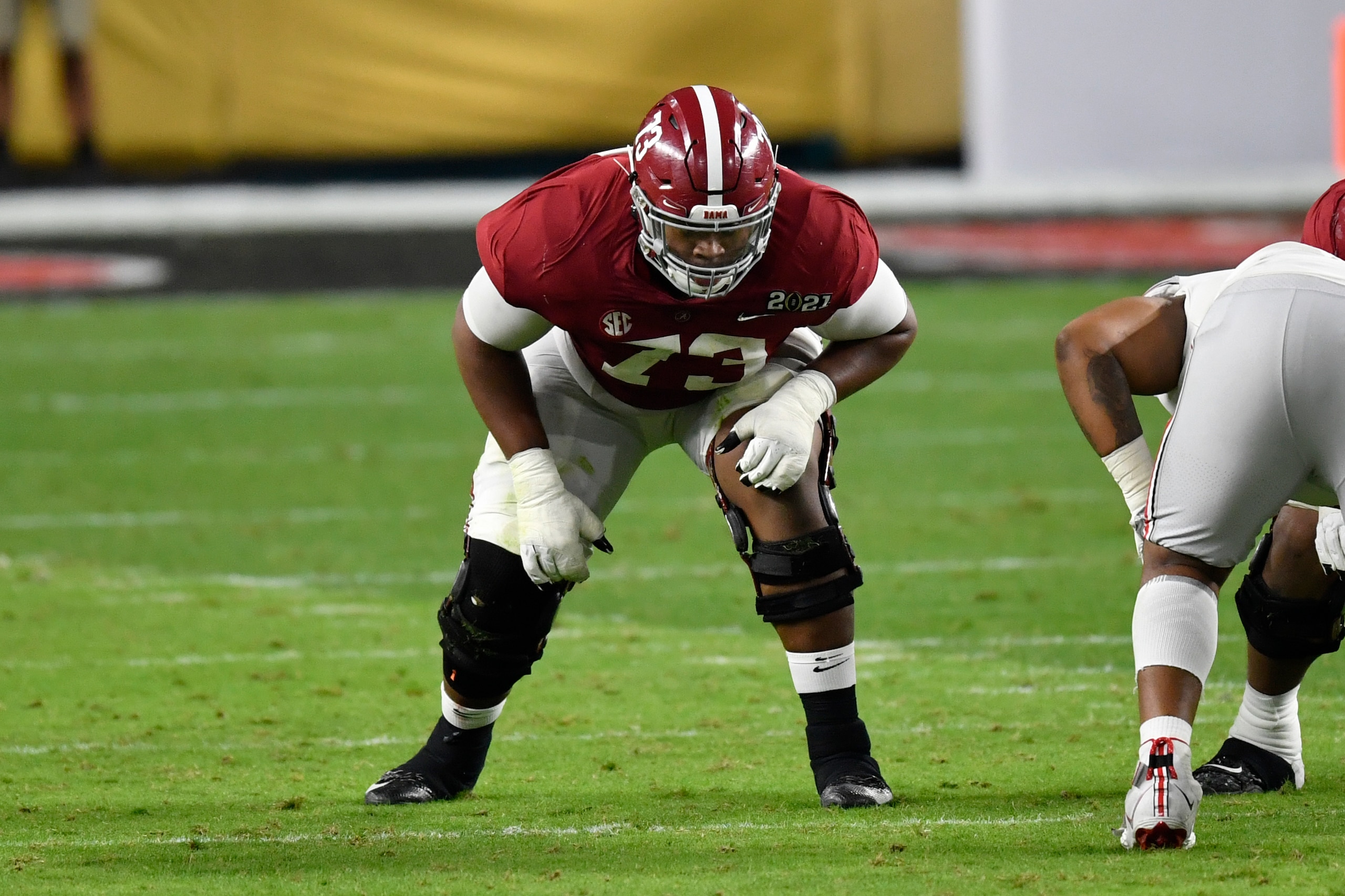 MIAMI GARDENS, FLORIDA - JANUARY 11: Evan Neal #73 of the Alabama Crimson Tide sits in his stance during the College Football Playoff National Championship football game against the Ohio State Buckeyes at Hard Rock Stadium on January 11, 2021 in Miami Gardens, Florida. The Alabama Crimson Tide defeated the Ohio State Buckeyes 52-24. (Photo by Alika Jenner/Getty Images)
