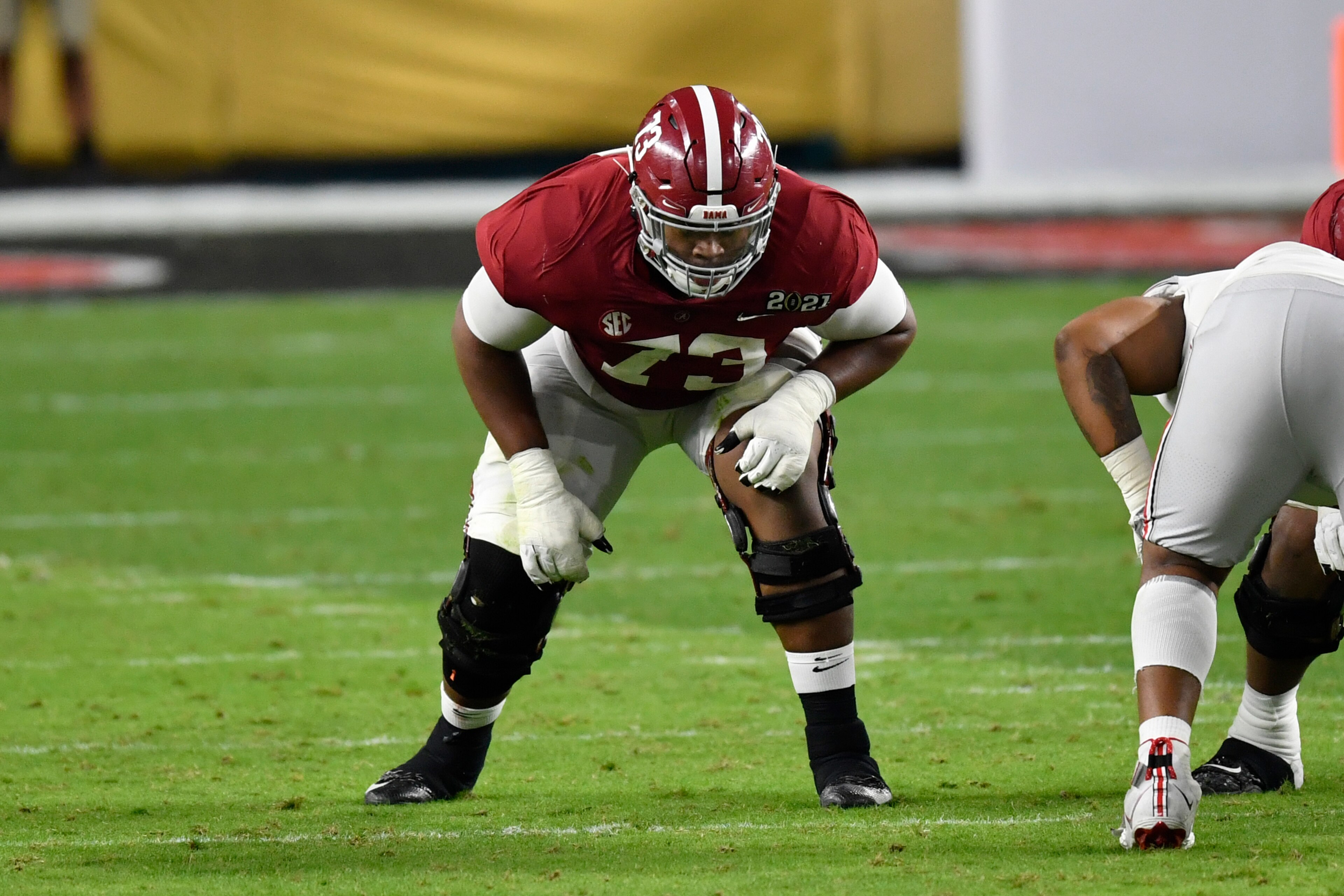MIAMI GARDENS, FLORIDA - JANUARY 11: Evan Neal #73 of the Alabama Crimson Tide sits in his stance during the College Football Playoff National Championship football game against the Ohio State Buckeyes at Hard Rock Stadium on January 11, 2021 in Miami Gardens, Florida. The Alabama Crimson Tide defeated the Ohio State Buckeyes 52-24. (Photo by Alika Jenner/Getty Images) MIAMI GARDENS, FLORIDA - JANUARY 11: Evan Neal #73 of the Alabama Crimson Tide sits in his stance during the College Football Playoff National Championship football game against the Ohio State Buckeyes at Hard Rock Stadium on January 11, 2021 in Miami Gardens, Florida. The Alabama Crimson Tide defeated the Ohio State Buckeyes 52-24. (Photo by Alika Jenner/Getty Images)