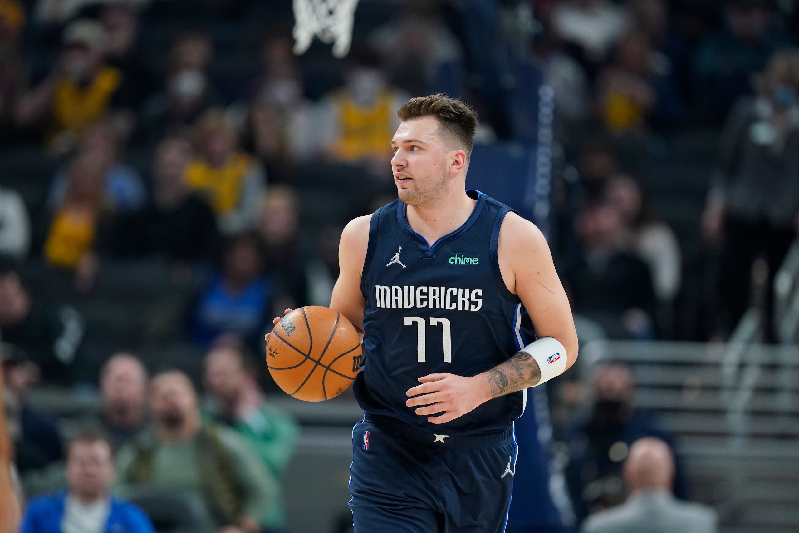 Dallas Mavericks' Luka Doncic dribbles during the first half of an NBA basketball game against the Indiana Pacers, Friday, Dec. 10, 2021, in Indianapolis. (AP Photo/Darron Cummings)