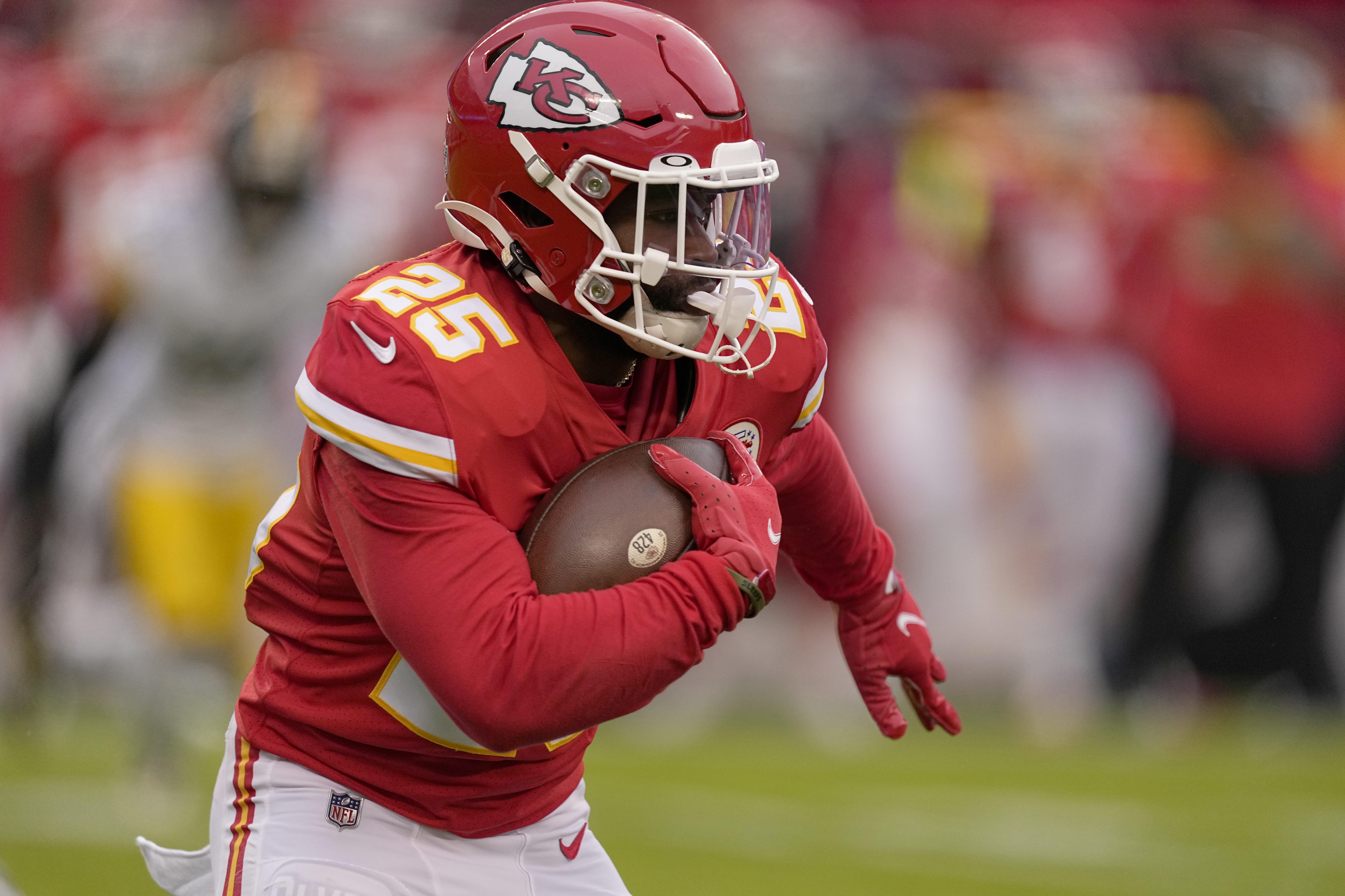 Kansas City Chiefs running back Clyde Edwards-Helaire runs with the ball during the first half of an NFL football game against the Pittsburgh Steelers Sunday, Dec. 26, 2021, in Kansas City, Mo. (AP Photo/Charlie Riedel)