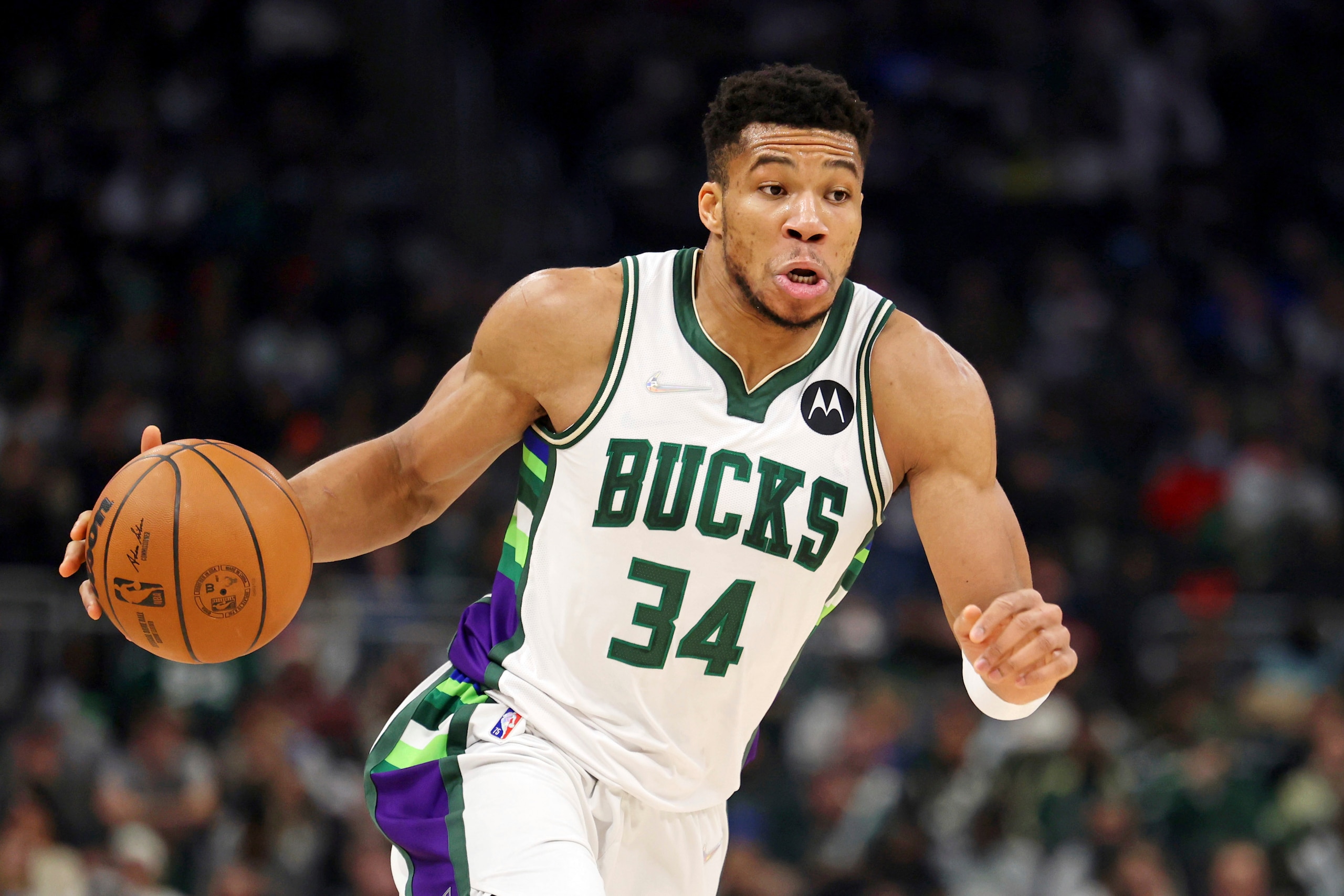 Milwaukee Bucks forward Giannis Antetokounmpo (34) dribbles the ball against the Boston Celtics during the first half of an NBA basketball game, Saturday, Dec. 25, 2021, in Milwaukee. (AP Photo/Jon Durr)