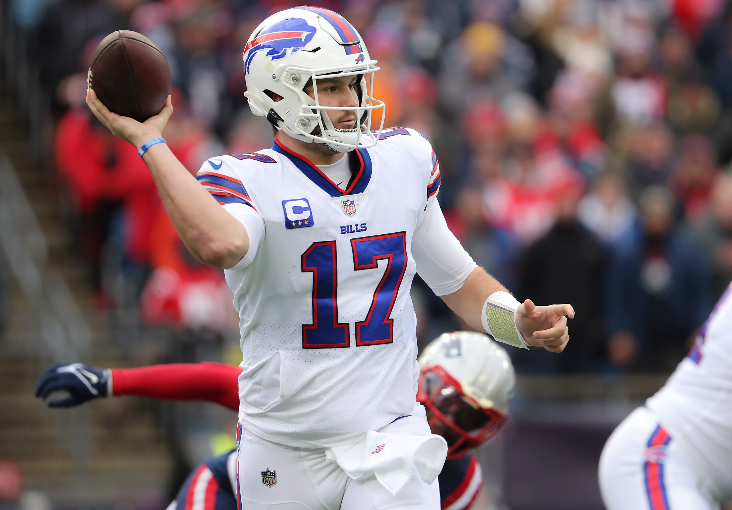 Foxborough, MA - December 26: Buffalo Bills Josh Allen completes a touch pass against the New England Patriots during second quarter NFL action. The New England Patriots host the Buffalo Bills in an NFL game on Sunday, Dec. 26, 2021 at Gillette Stadium in Foxborough, MA. (Photo by Matthew J. Lee/The Boston Globe via Getty Images)