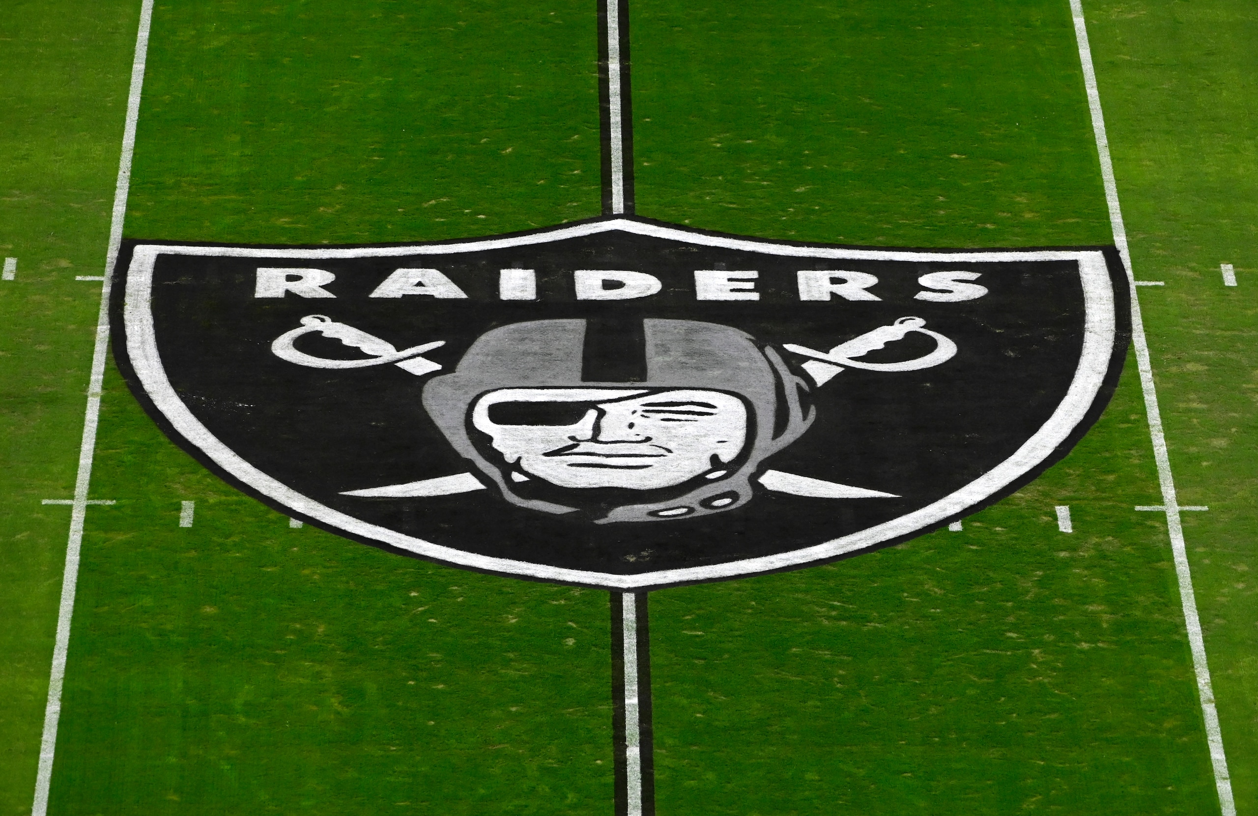The Las Vegas Raiders logo is seen on the playing field prior to an NFL football game between the Las Vegas Raiders and the Kansas City Chiefs, Sunday, Nov. 22, 2020, in Las Vegas. (AP Photo/David Becker)