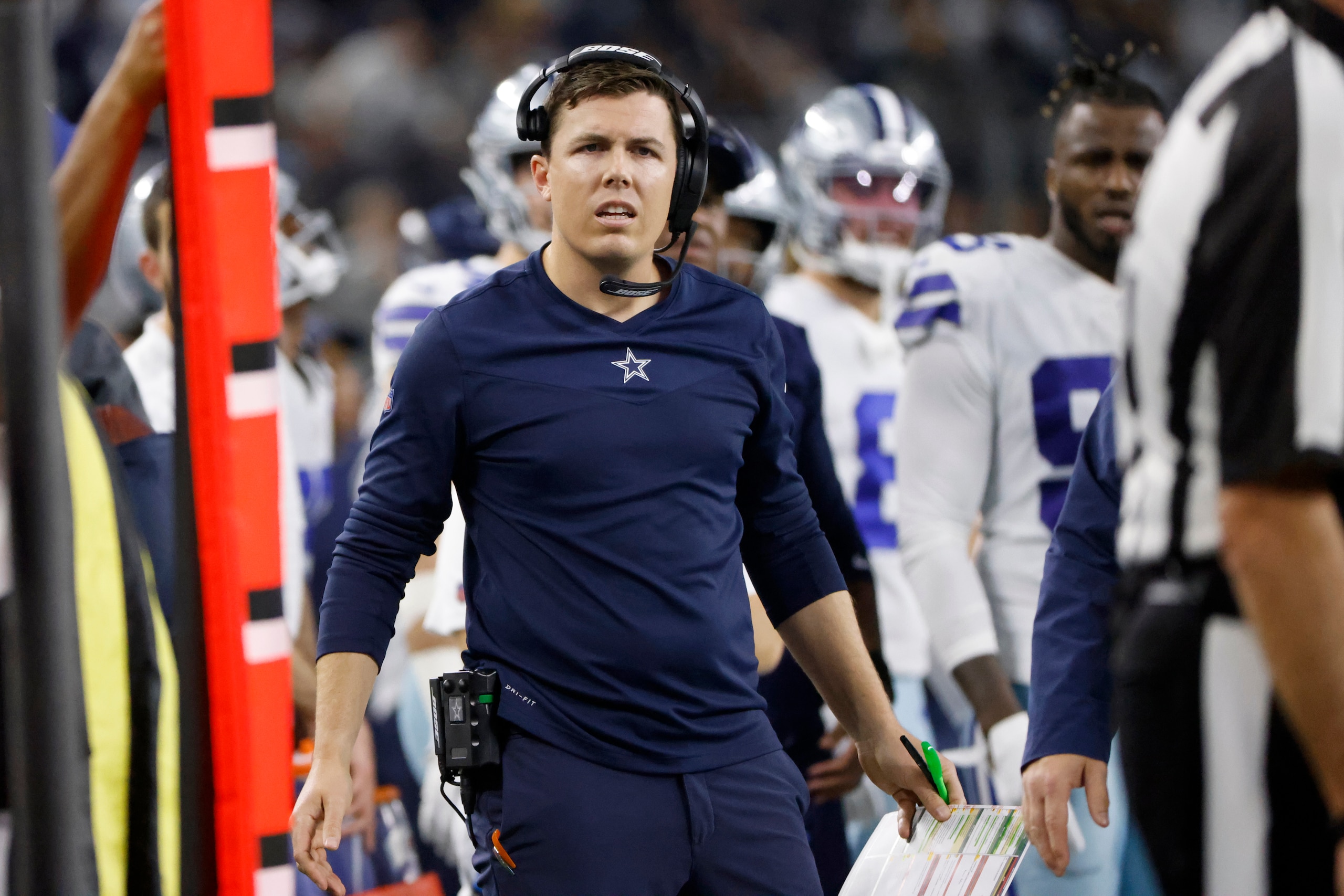 Dallas Cowboys offensive coordinator Kellen Moore reacts to an official during an overtime loss to the Las Vegas Raiders in an NFL football game in Arlington, Texas, Thursday, Nov. 25, 2021. (AP Photo/Ron Jenkins)