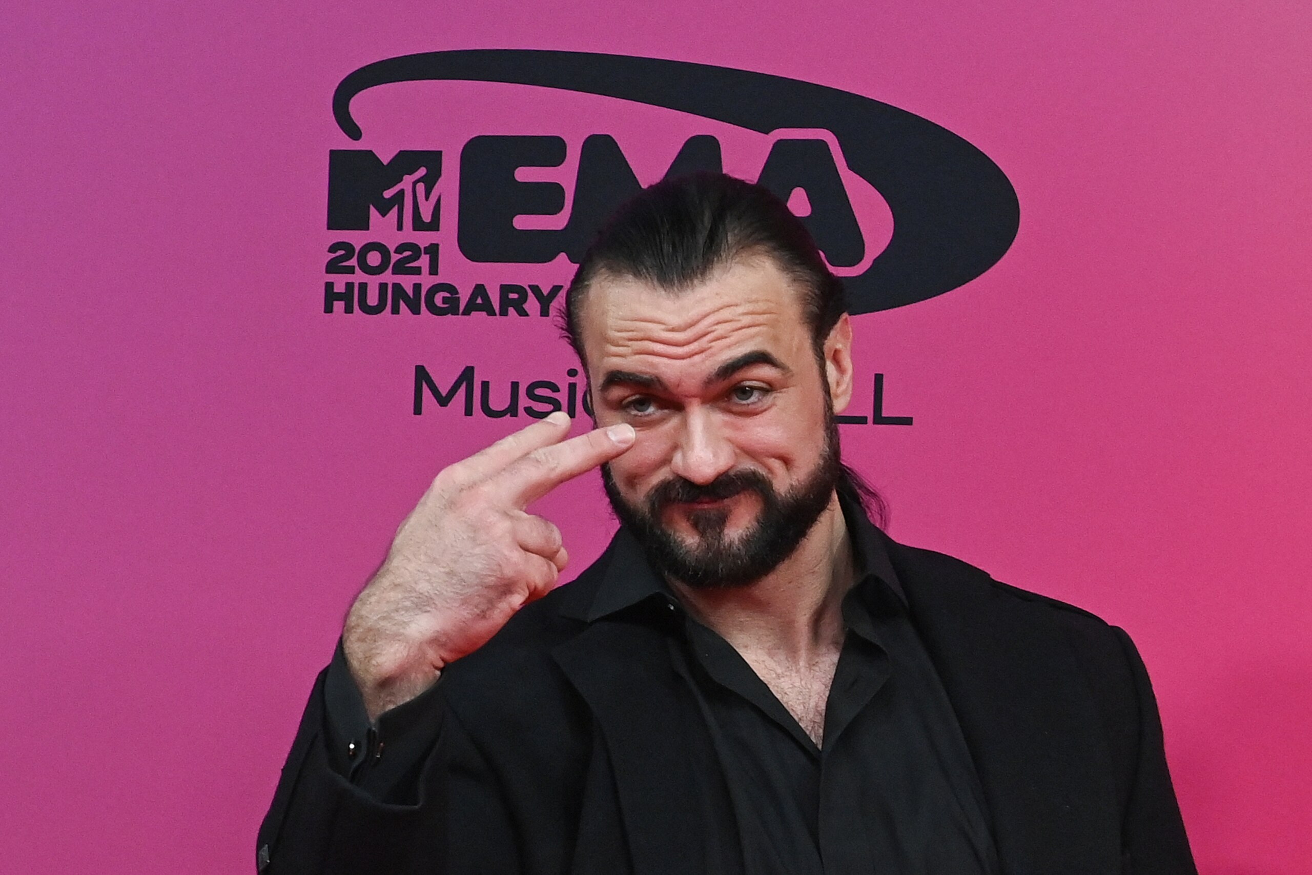 Scottish professional wrestler Drew McIntyre poses on the red carpet as he arrives for the MTV Europe Music Awards at the Laszlo Papp Budapest Sports Arena in Budapest, Hungary on November 14, 2021. (Photo by Attila KISBENEDEK / AFP) (Photo by ATTILA KISBENEDEK/AFP via Getty Images) Scottish professional wrestler Drew McIntyre poses on the red carpet as he arrives for the MTV Europe Music Awards at the Laszlo Papp Budapest Sports Arena in Budapest, Hungary on November 14, 2021. (Photo by Attila KISBENEDEK / AFP) (Photo by ATTILA KISBENEDEK/AFP via Getty Images)