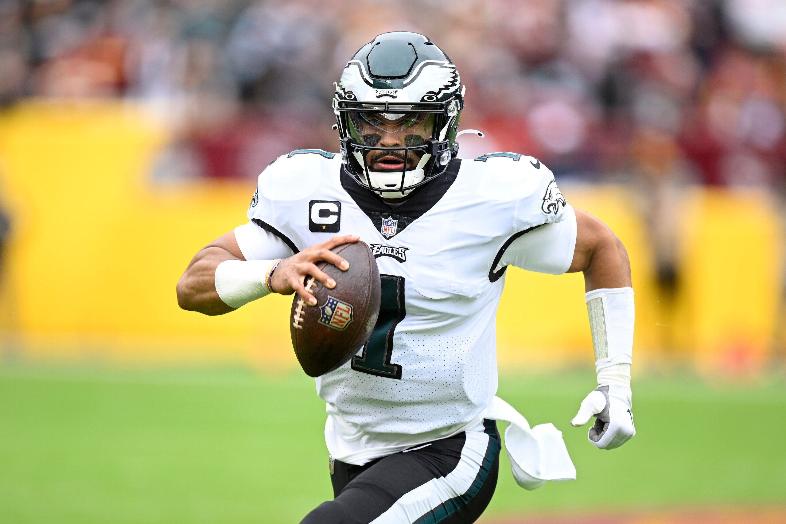 LANDOVER, MARYLAND - JANUARY 02: Jalen Hurts #1 of the Philadelphia Eagles runs the ball during the first quarter against the Washington Football Team at FedExField on January 02, 2022 in Landover, Maryland. (Photo by Greg Fiume/Getty Images)