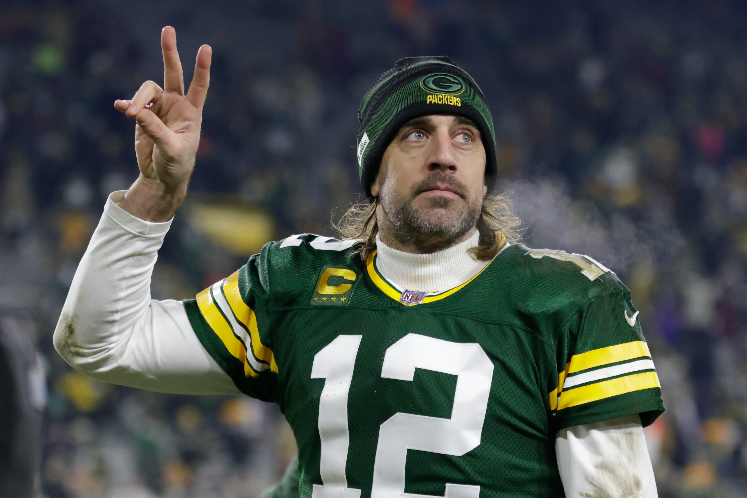 Green Bay Packers' Aaron Rodgers acknowledges the crowd after an NFL football game against the Minnesota Vikings Sunday, Jan. 2, 2022, in Green Bay, Wis. The Packers won 37-10. (AP Photo/Matt Ludtke)