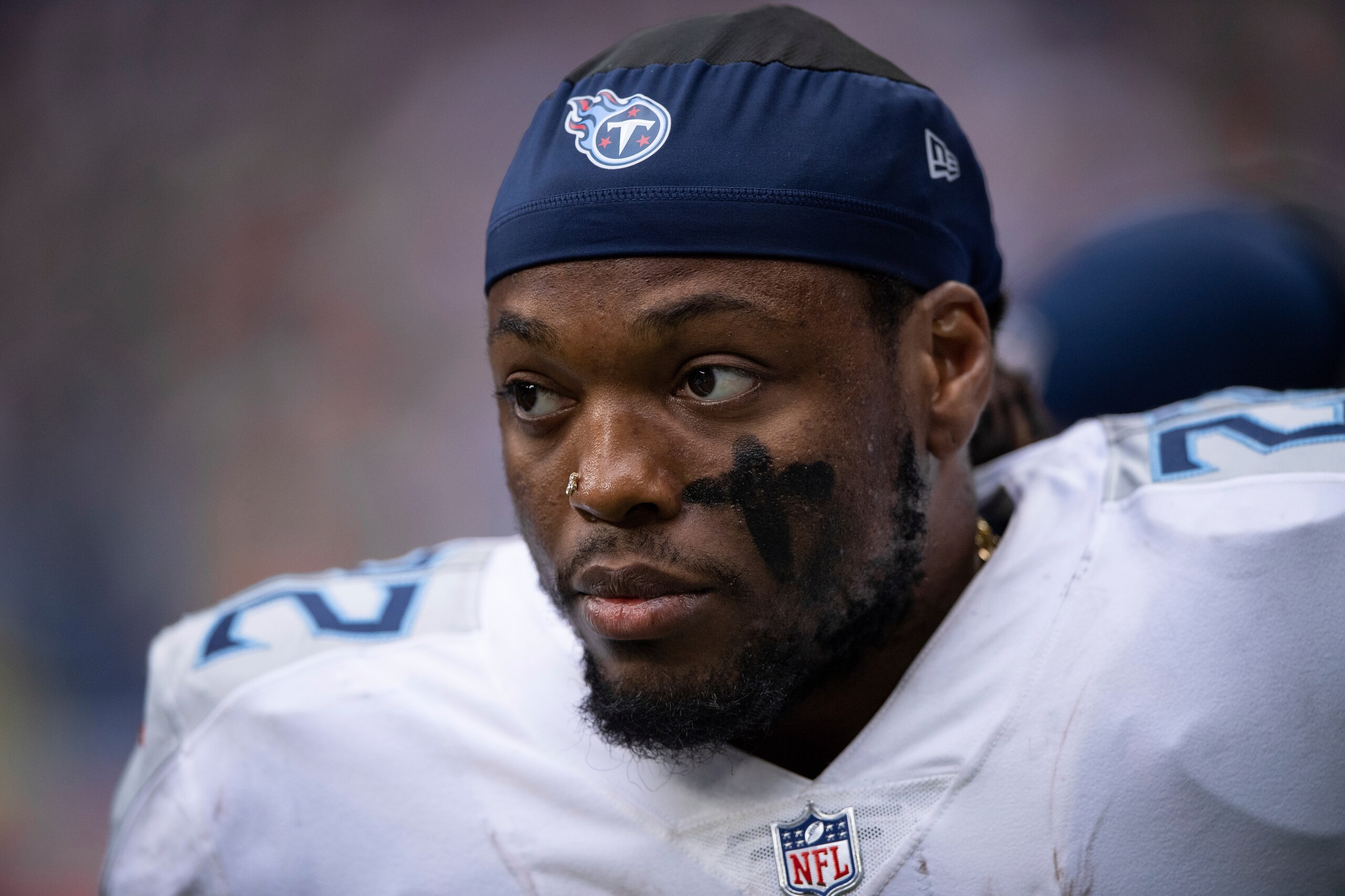 FILE - Tennessee Titans running back Derrick Henry (22) is shown on the sidelines during an NFL football game against the Indianapolis Colts, Sunday, Oct. 31, 2021, in Indianapolis. Derrick Henry is just the biggest name in a revolving door that has seen the Titans make 19 moves putting players on injured reserve and play a NFL-high 80 different players _ 11 more than the next closest teams. (AP Photo/Zach Bolinger, File)