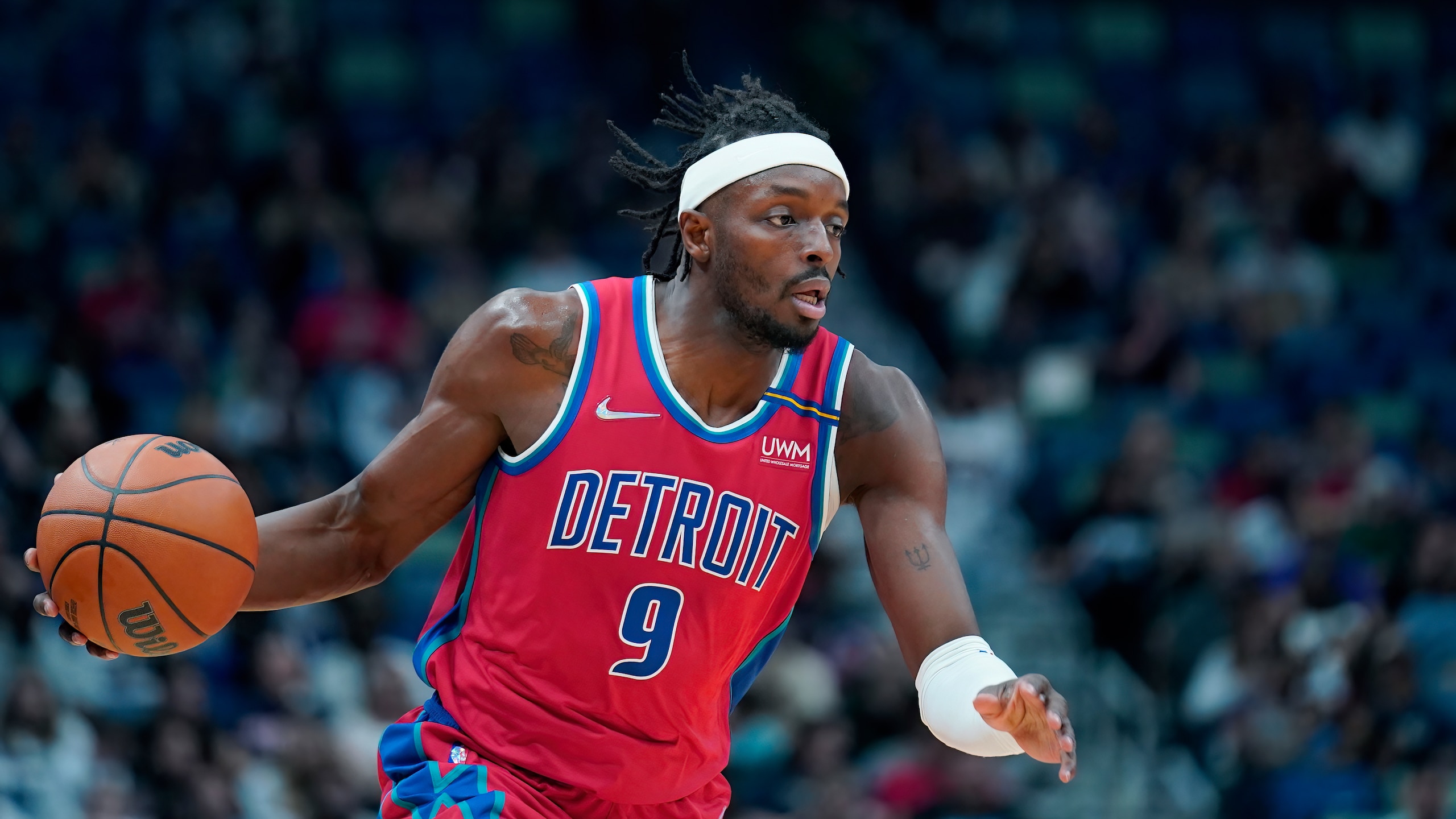Detroit Pistons forward Jerami Grant (9) moves the ball up court in the first half of an NBA basketball game against the New Orleans Pelicans in New Orleans, Friday, Dec. 10, 2021. (AP Photo/Gerald Herbert)