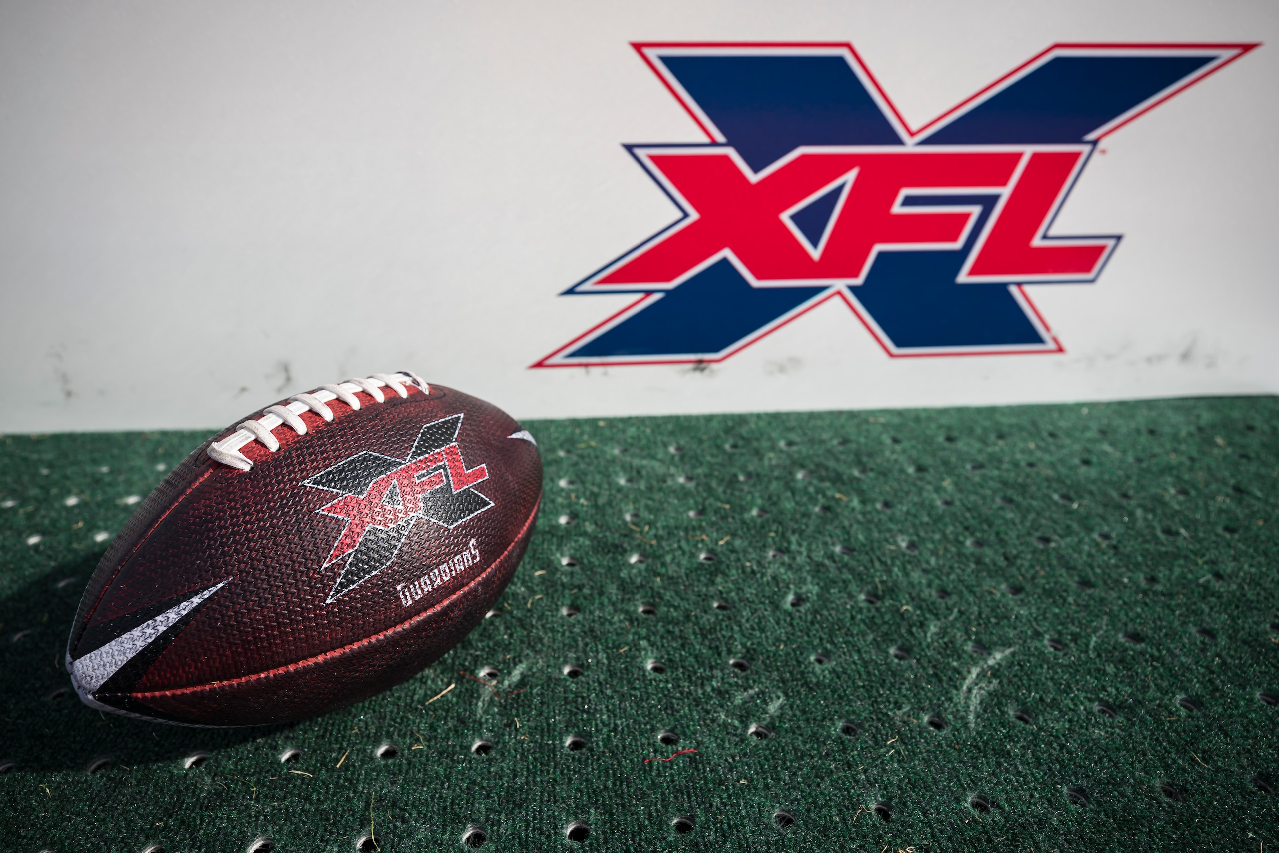 WASHINGTON, DC - FEBRUARY 15: A detailed view of a NY Guardians XFL football in front of an XFL logo on the sideline before the game between the DC Defenders and the NY Guardians at Audi Field on February 15, 2020 in Washington, DC. (Photo by Scott Taetsch/Getty Images)