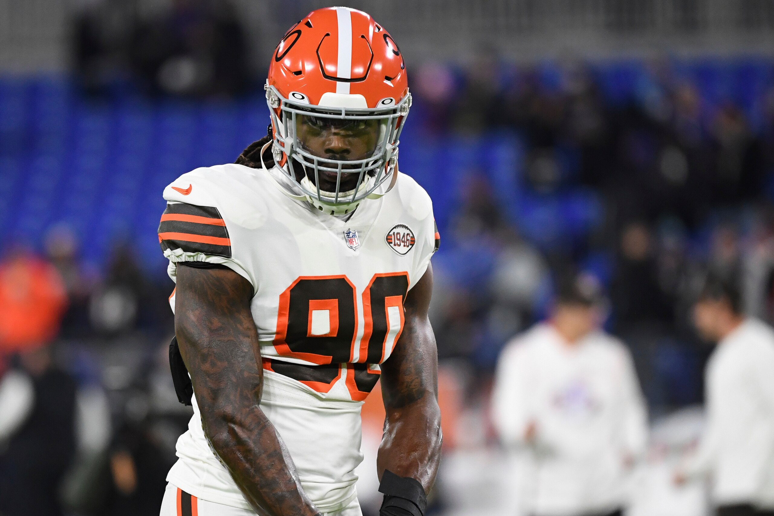 Cleveland Browns defensive end Jadeveon Clowney (90) looks on during pre-game warm-ups before an NFL football game against the Baltimore Ravens, Sunday, Nov. 28, 2021, in Baltimore. (AP Photo/Terrance Williams)