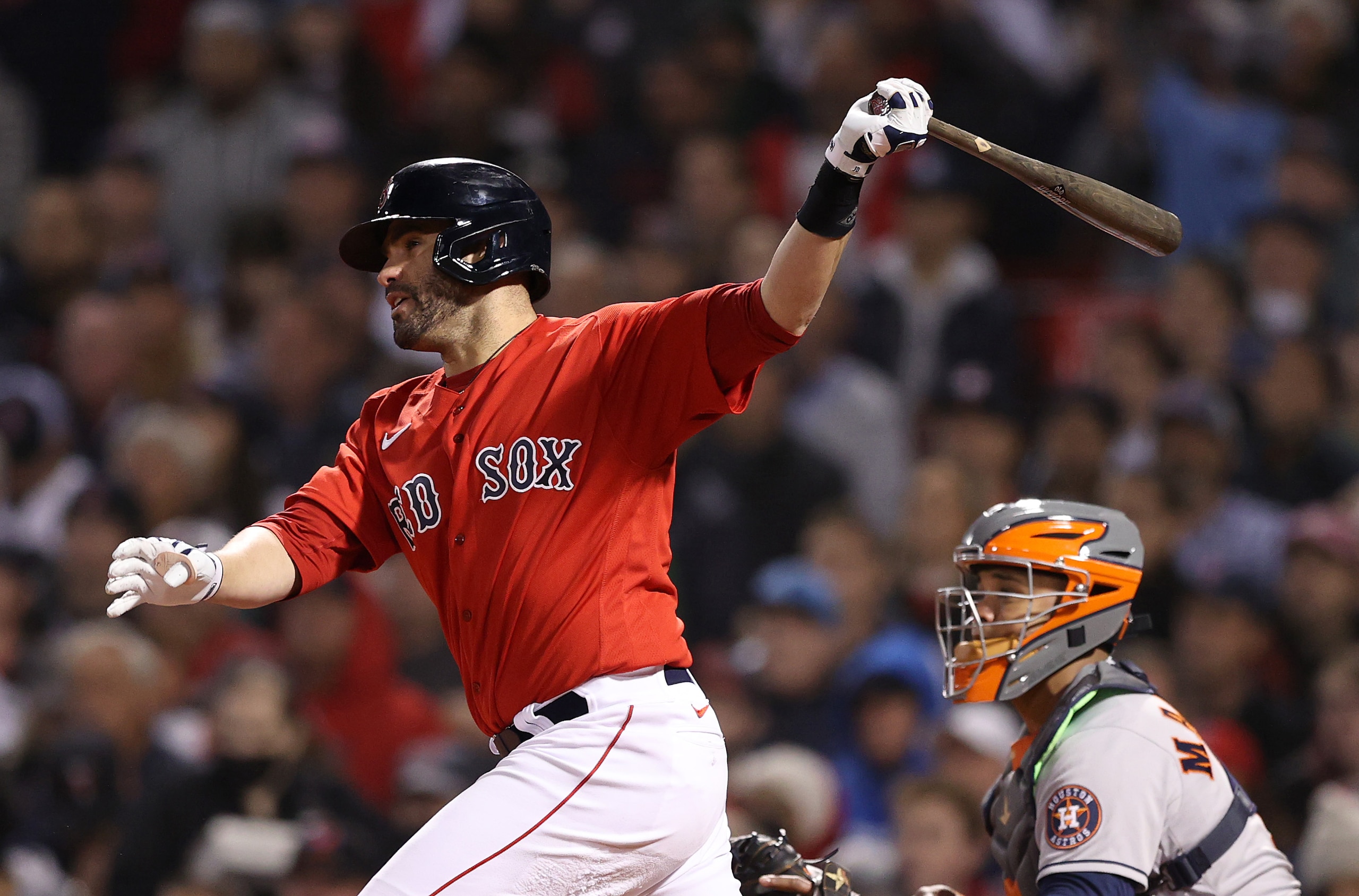 BOSTON, MASSACHUSETTS - OCTOBER 18: J.D. Martinez #28 of the Boston Red Sox hits a double against the Houston Astros in the second inning of Game Three of the American League Championship Series at Fenway Park on October 18, 2021 in Boston, Massachusetts. (Photo by Elsa/Getty Images)