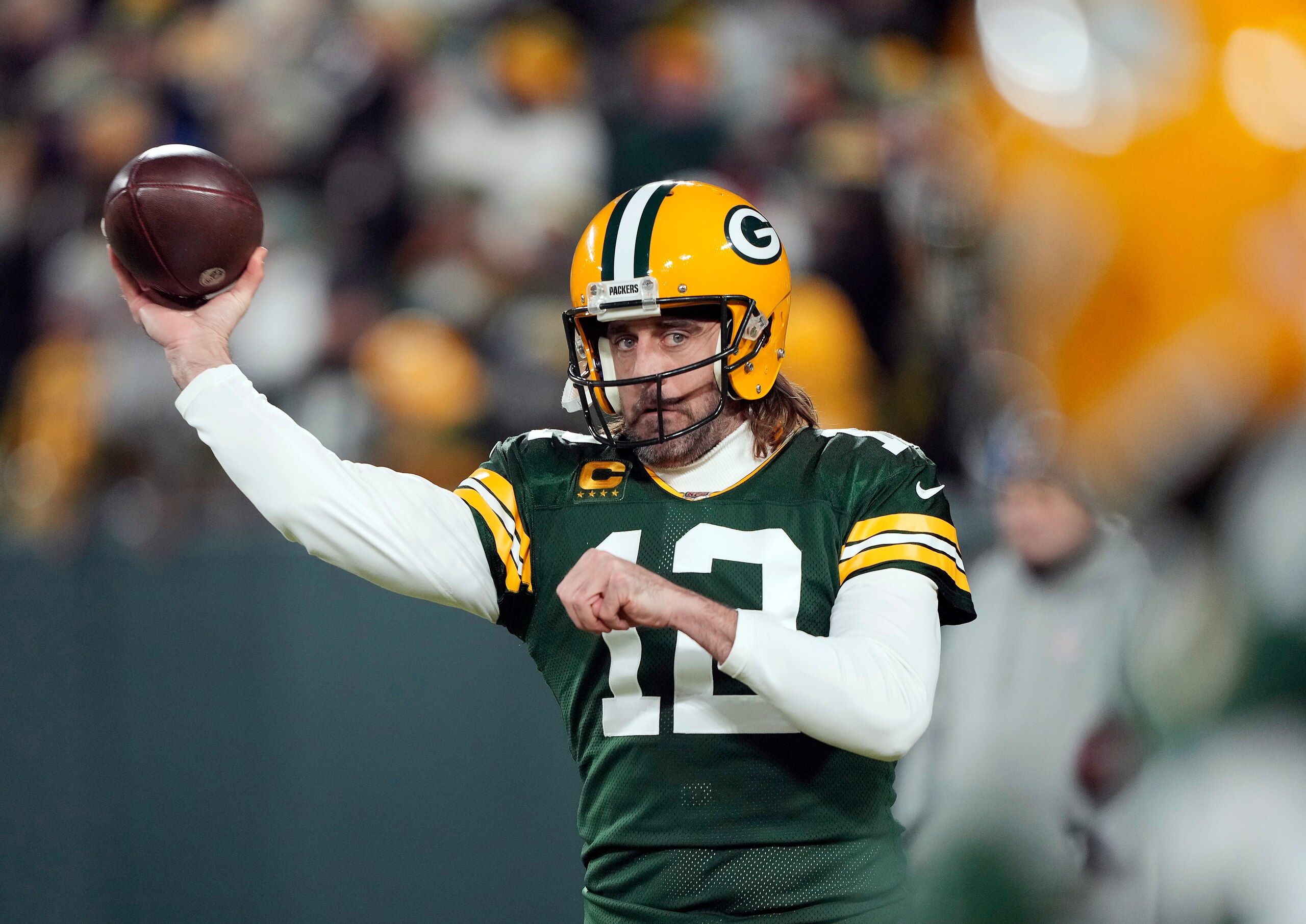 GREEN BAY, WISCONSIN - JANUARY 02:  Quarterback Aaron Rodgers #12 of the Green Bay Packers warms up prior to the game against the Minnesota Vikings at Lambeau Field on January 02, 2022 in Green Bay, Wisconsin. (Photo by Patrick McDermott/Getty Images)