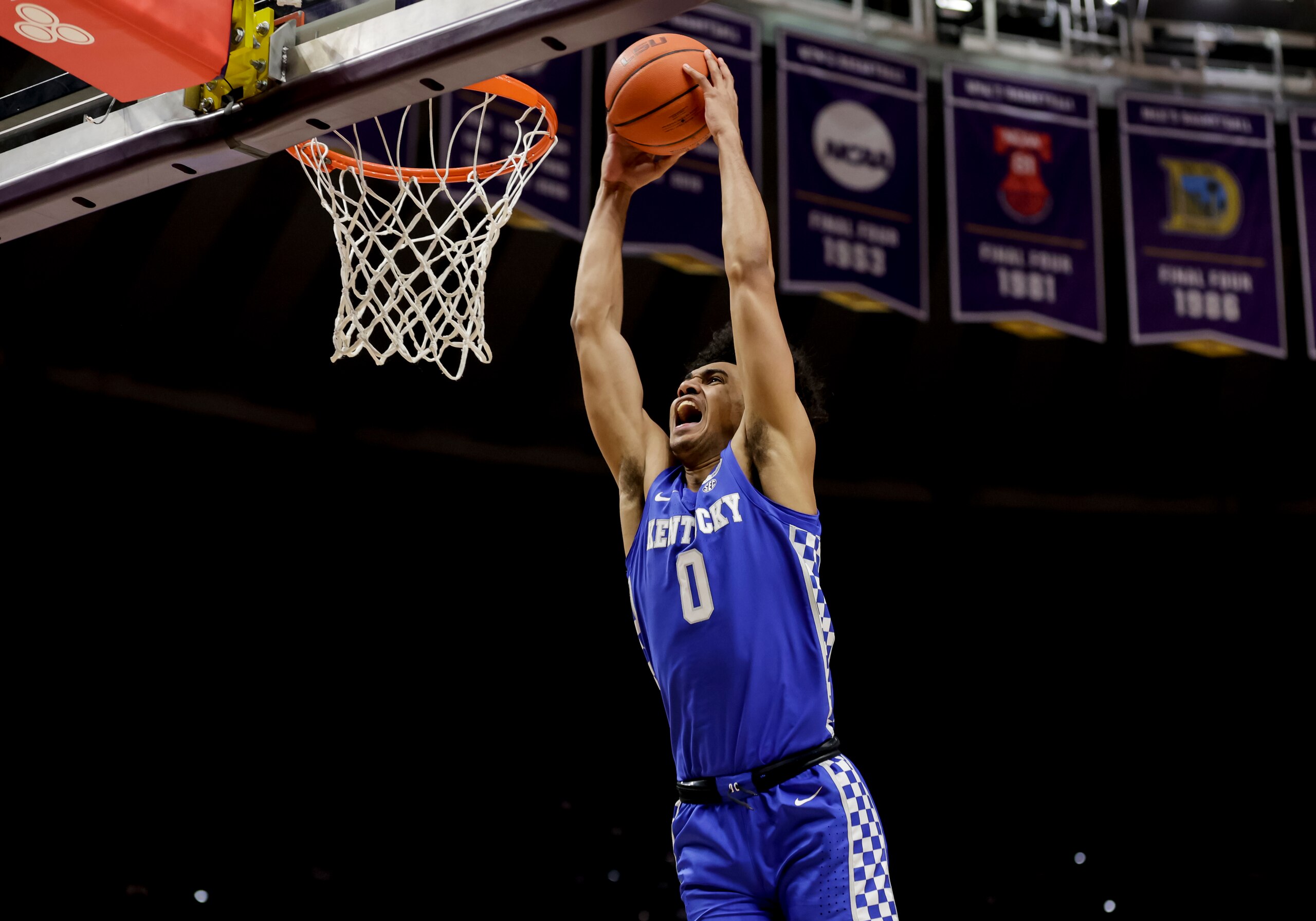 Kentucky forward Jacob Toppin (0) dunks against LSU in the first half of an NCAA college basketball game  in Baton Rouge, La., Tuesday, Jan. 4, 2022. (AP Photo/Derick Hingle)