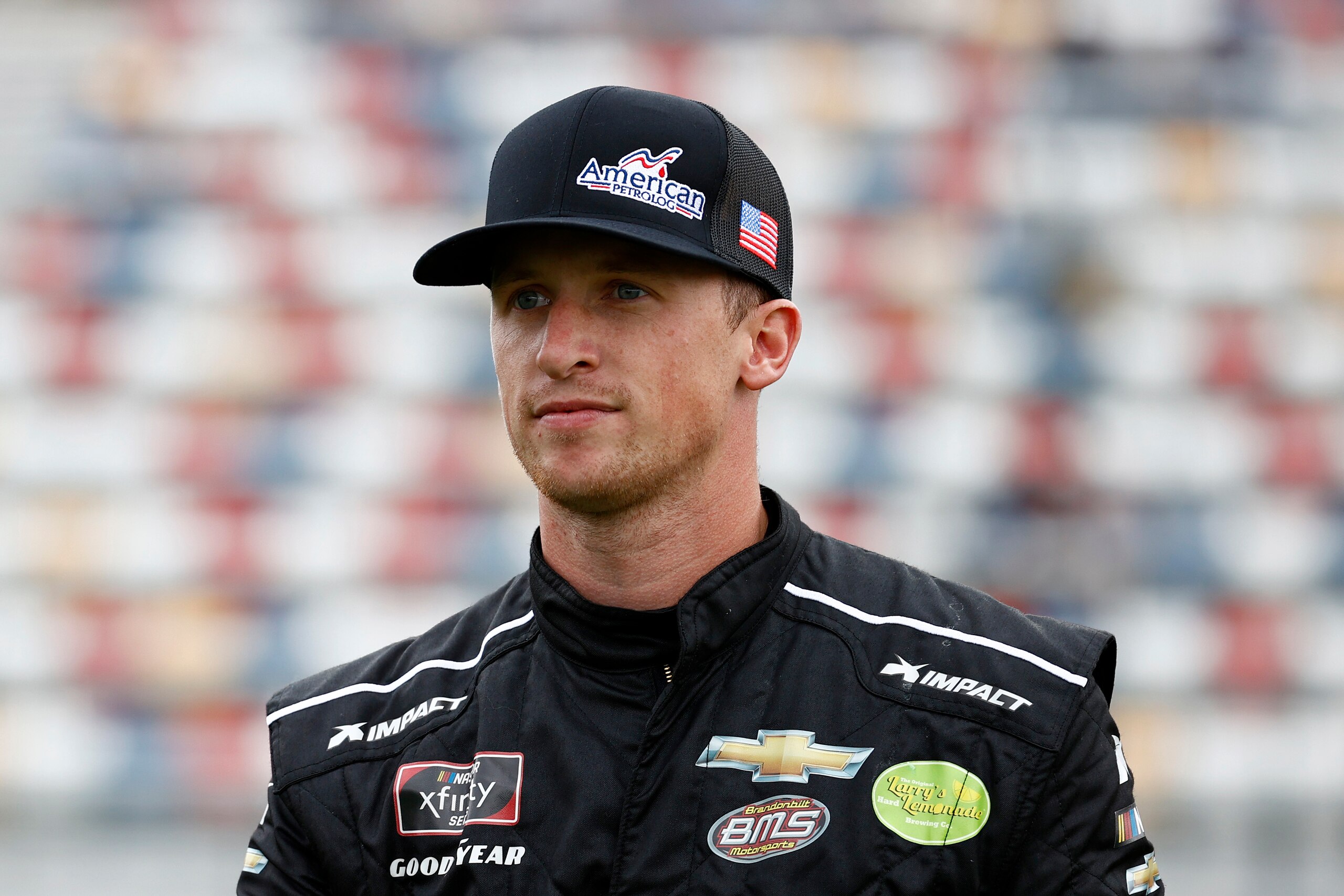 CONCORD, NORTH CAROLINA - OCTOBER 09: Brandon Brown, driver of the #68 American PetroLog Chevrolet, walks the grid prior to the NASCAR Xfinity Series Drive for the Cure 250 presented by Blue Cross Blue Shield of North Carolina at Charlotte Motor Speedway on October 09, 2021 in Concord, North Carolina. (Photo by Jared C. Tilton/Getty Images) CONCORD, NORTH CAROLINA - OCTOBER 09: Brandon Brown, driver of the #68 American PetroLog Chevrolet, walks the grid prior to the NASCAR Xfinity Series Drive for the Cure 250 presented by Blue Cross Blue Shield of North Carolina at Charlotte Motor Speedway on October 09, 2021 in Concord, North Carolina. (Photo by Jared C. Tilton/Getty Images)