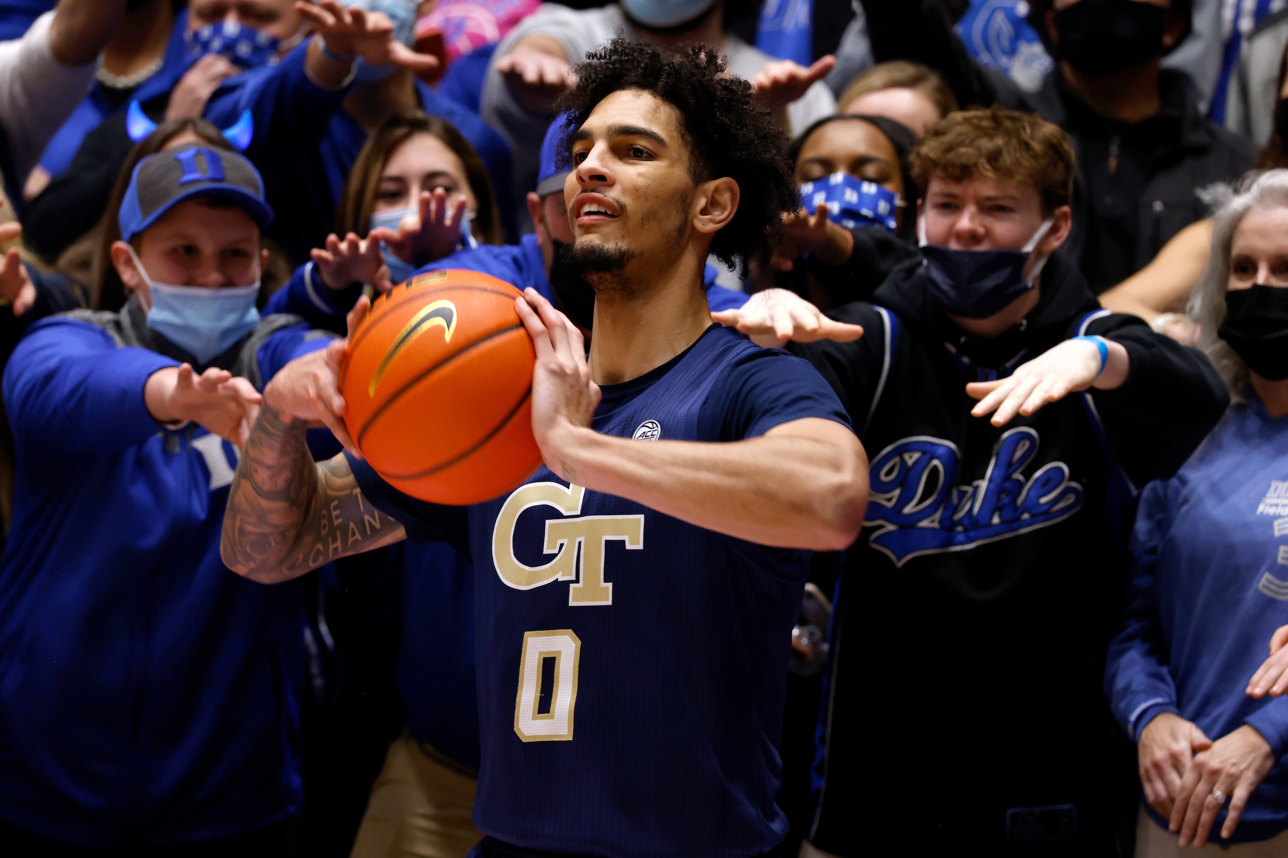 DURHAM, NC - JANUARY 04: Fans of the Duke Blue Devils try to distract Michael Devoe #0 of the Georgia Tech Yellow Jackets in the second half at Cameron Indoor Stadium on January 4, 2022 in Durham, North Carolina. (Photo by Lance King/Getty Images)