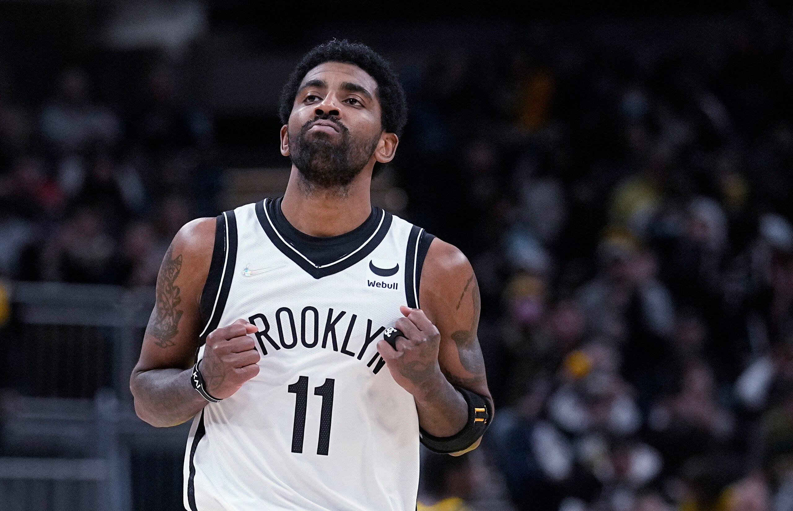 Brooklyn Nets' Kyrie Irving reacts after hitting a shot during the second half of the team's NBA basketball game against the Indiana Pacers, Wednesday, Jan. 5, 2022, in Indianapolis. (AP Photo/Darron Cummings) Brooklyn Nets' Kyrie Irving reacts after hitting a shot during the second half of the team's NBA basketball game against the Indiana Pacers, Wednesday, Jan. 5, 2022, in Indianapolis. (AP Photo/Darron Cummings)