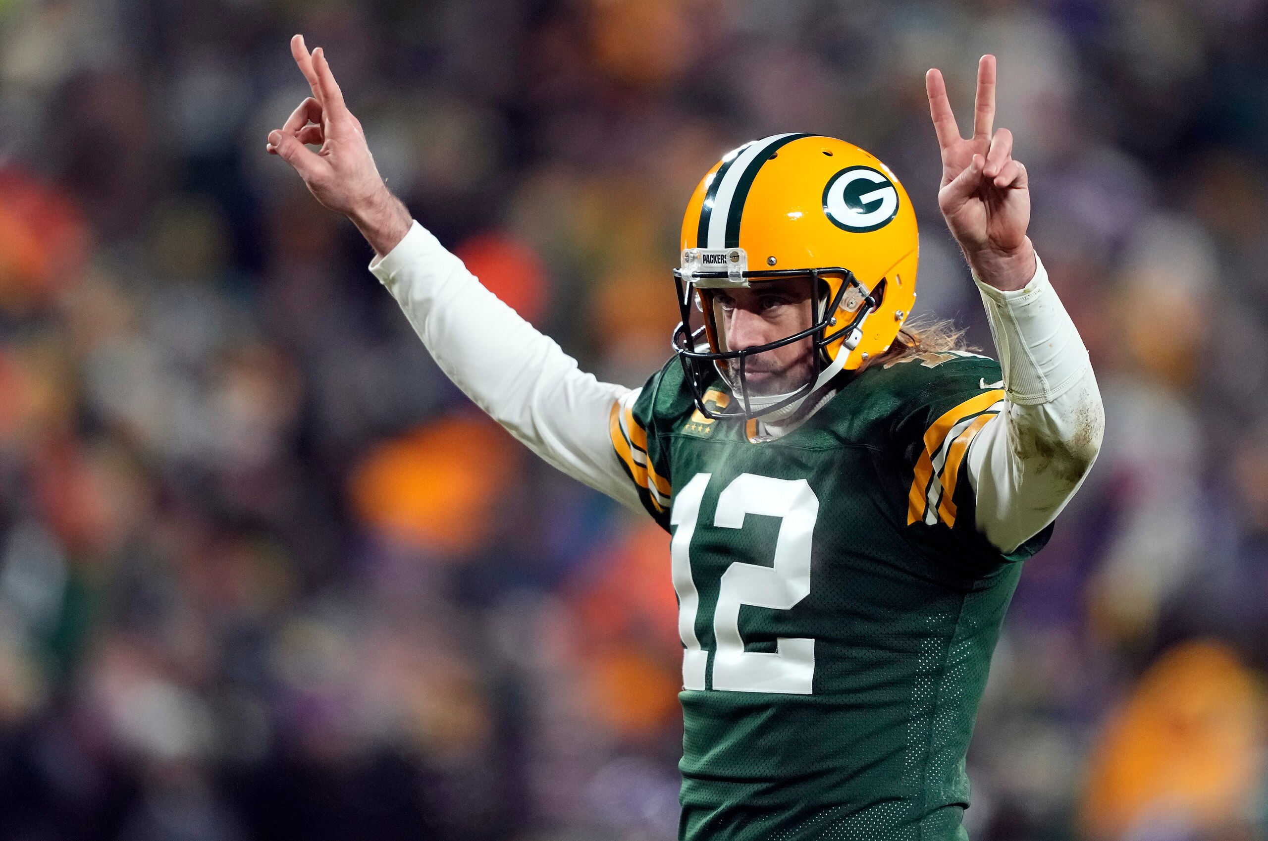 GREEN BAY, WISCONSIN - JANUARY 02: Quarterback Aaron Rodgers #12 of the Green Bay Packers celebrates after a touchdown during the 3rd quarter of the game against the Minnesota Vikings at Lambeau Field on January 02, 2022 in Green Bay, Wisconsin. (Photo by Patrick McDermott/Getty Images)