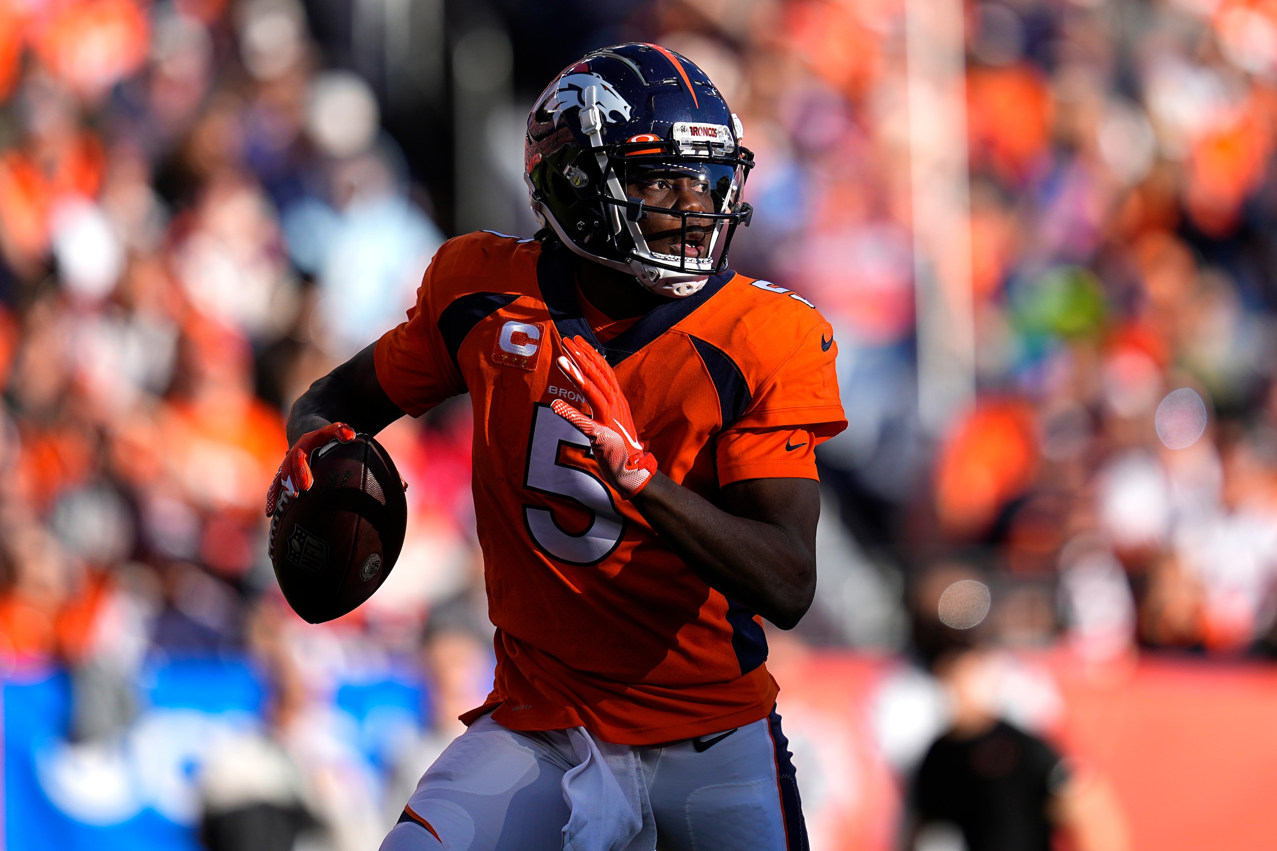 Denver Broncos quarterback Teddy Bridgewater (5) scrambles against the Cincinnati Bengals during the first half of an NFL football game, Sunday, Dec. 19, 2021, in Denver. (AP Photo/Jack Dempsey)