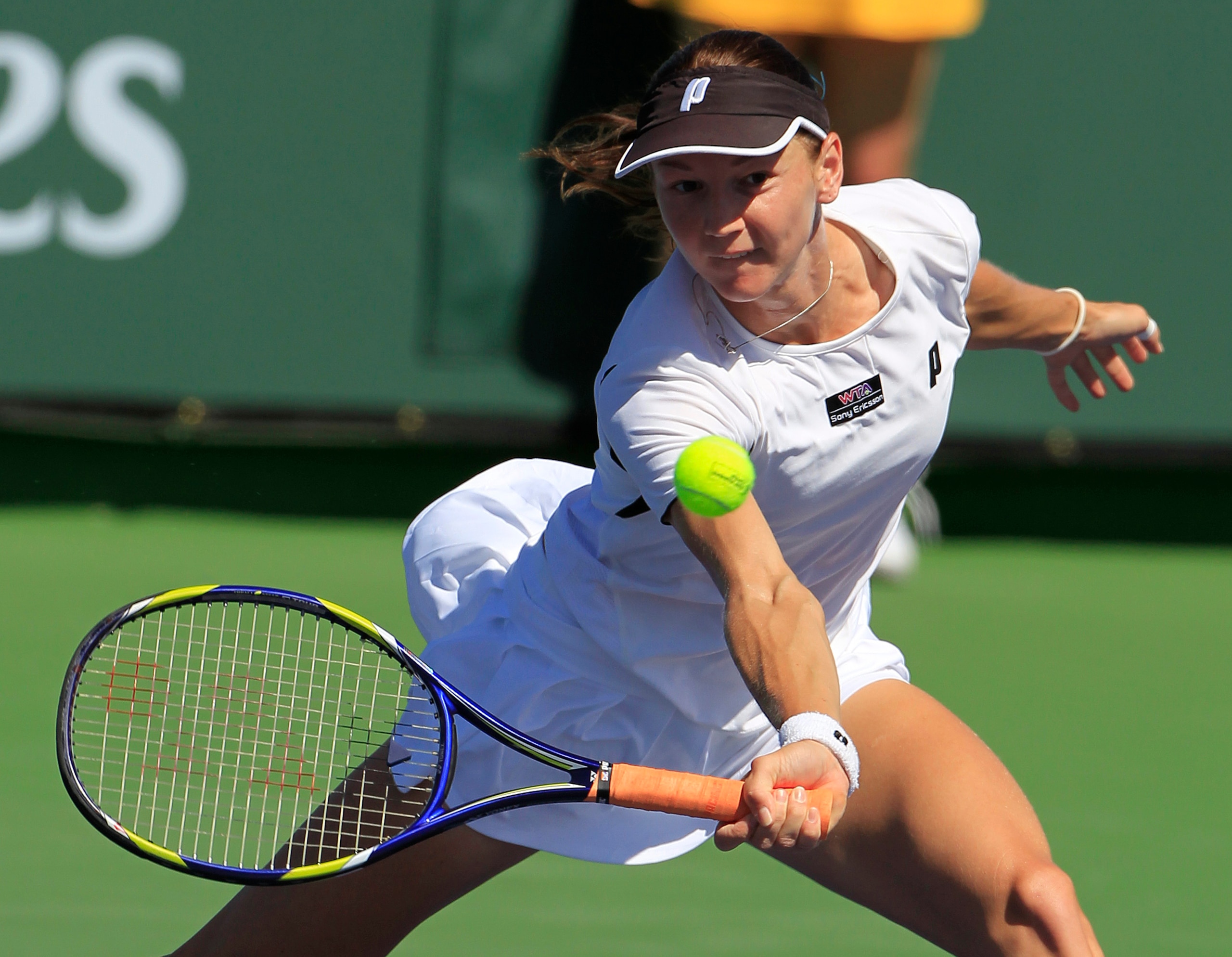 FILE - Renata Voracova of the Czech Republic returns a shot to Shuai Peng of China during a first round match at the BNP Paribas Open tennis tournament in Indian Wells, Calif., on March 10, 2011. The Australian Broadcasting Corp. reported later Friday, Jan. 7, 2022, that Voracova, a 38-year-old doubles player from the Czech Republic, had her visa canceled and was taken to the same hotel where Novak Djokovic is staying. (AP Photo/Darron Cummings, File)