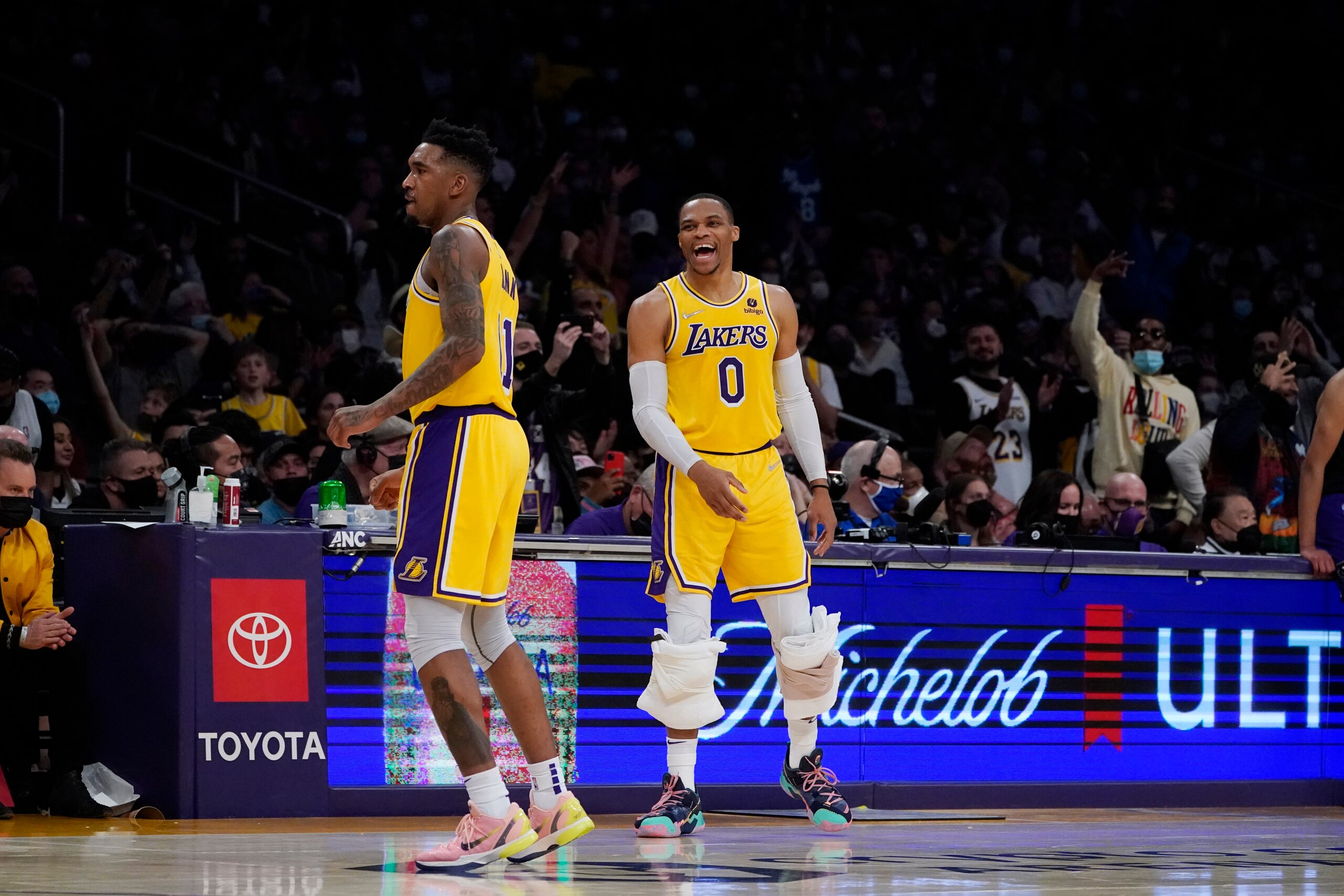 Los Angeles Lakers guard Malik Monk (11) celebrates with guard Russell Westbrook after scoring during the second half of an NBA basketball game against the Sacramento Kings Tuesday, Jan. 4, 2022, in Los Angeles. (AP Photo/Marcio Jose Sanchez)