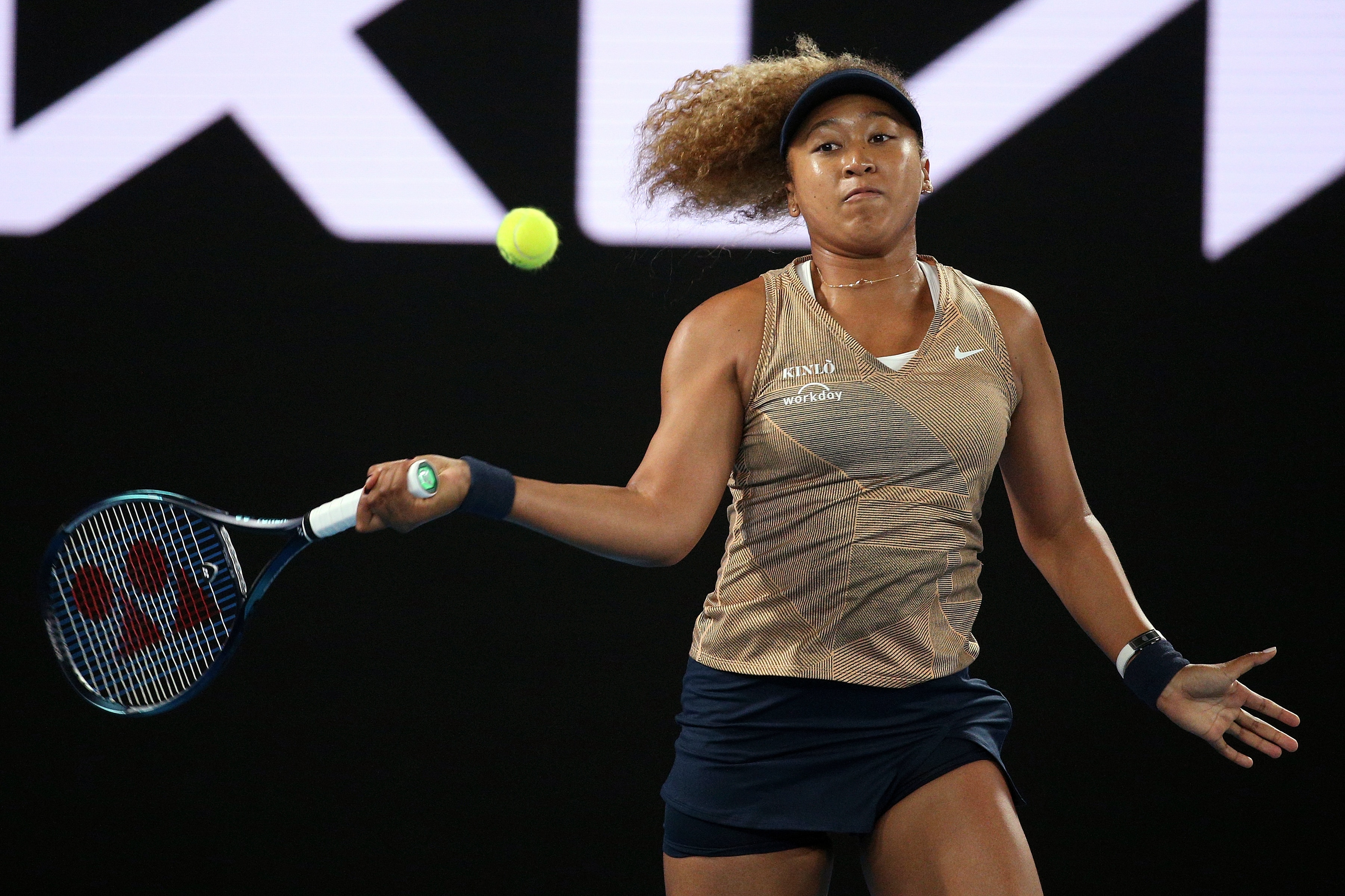 Naomi Osaka of Japan plays a forehand during their singles match against Andrea Petkovic of Germany at Summer Set tennis tournament ahead of the Australian Open in Melbourne, Australia, Friday, Jan. 7, 2022. (AP Photo/Hamish Blair)