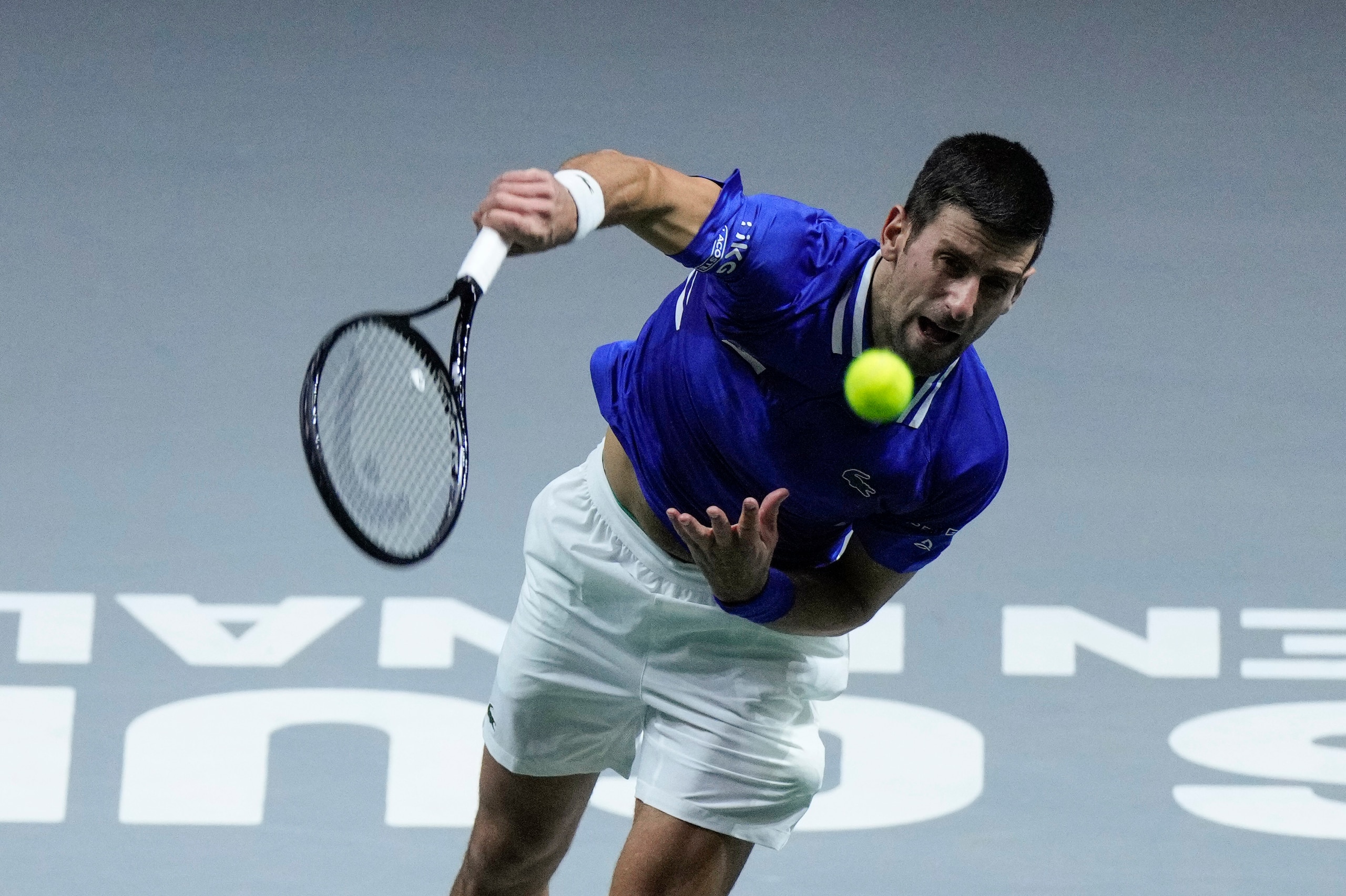Serbia's Novak Djokovic serves the ball to Croatia's Marin Cilic during their Davis Cup tennis semi-final match at Madrid Arena in Madrid, Spain, Friday, Dec. 3, 2021. (AP Photo/Bernat Armangue) Serbia's Novak Djokovic serves the ball to Croatia's Marin Cilic during their Davis Cup tennis semi-final match at Madrid Arena in Madrid, Spain, Friday, Dec. 3, 2021. (AP Photo/Bernat Armangue)