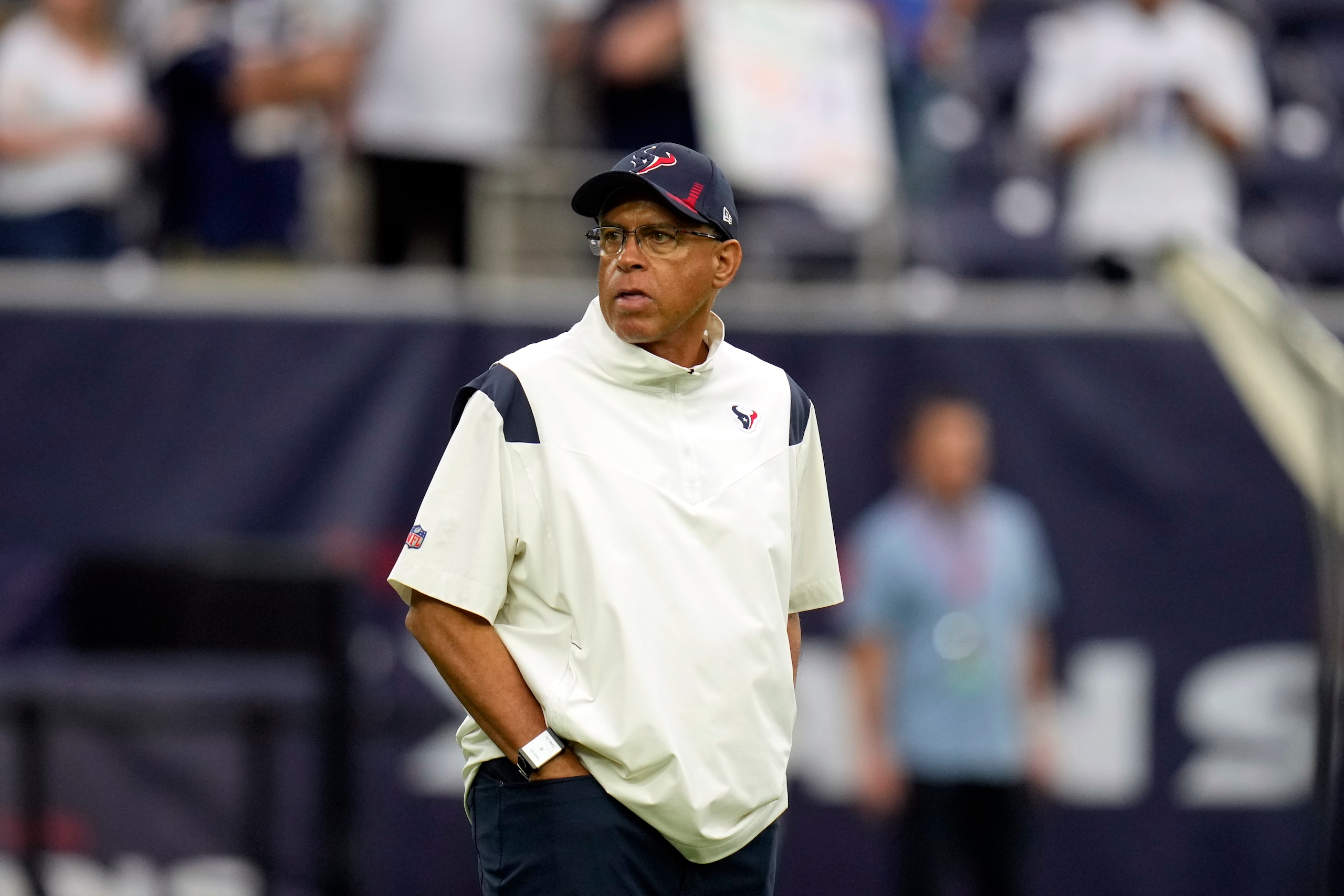 Houston Texans head coach David Culley watches his team warm up before an NFL football game against the Los Angeles Chargers Sunday, Dec. 26, 2021, in Houston. (AP Photo/Eric Christian Smith)