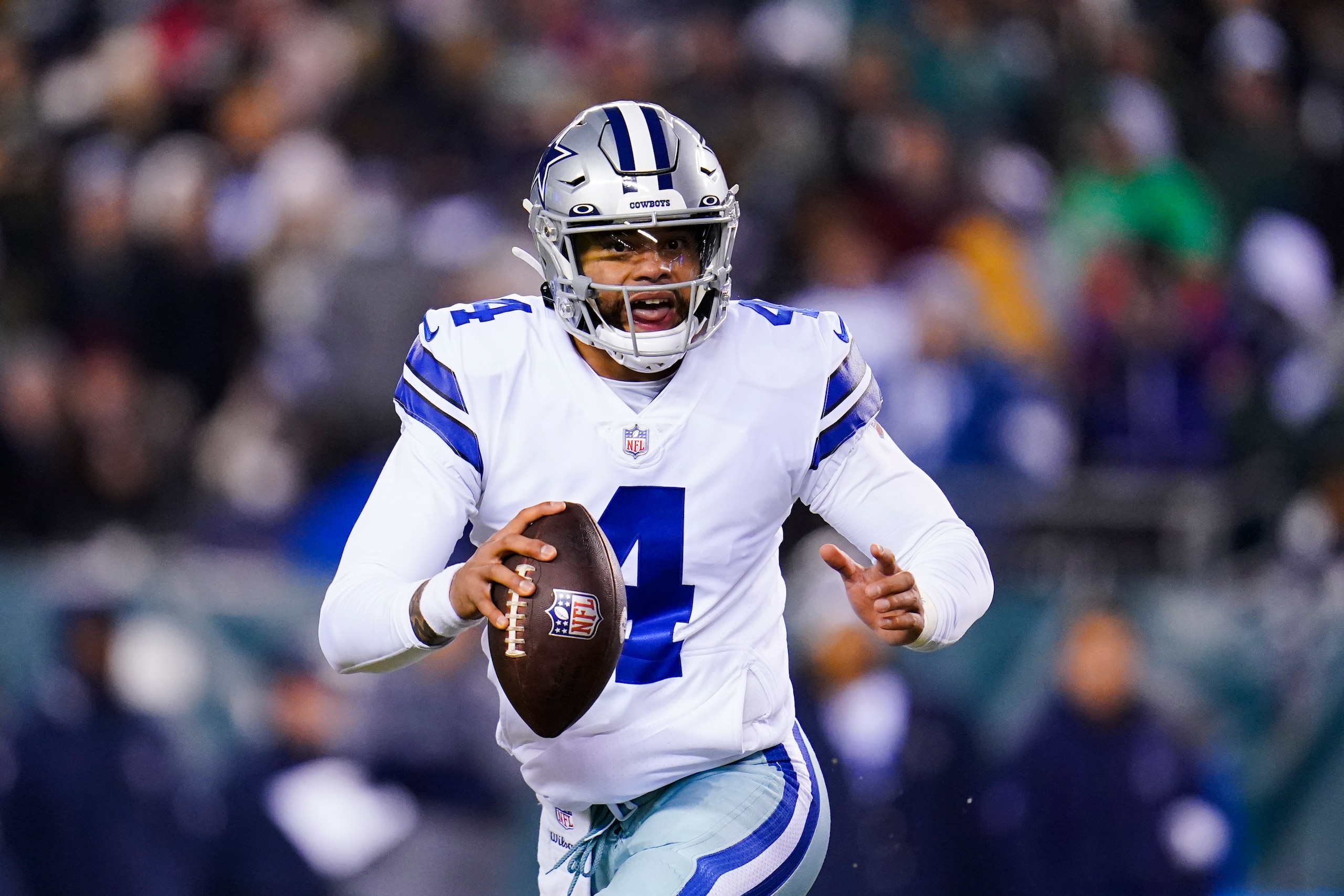 Dallas Cowboys quarterback Dak Prescott plays during the first half of an NFL football game against the Philadelphia Eagles, Saturday, Jan. 8, 2022, in Philadelphia. (AP Photo/Julio Cortez)