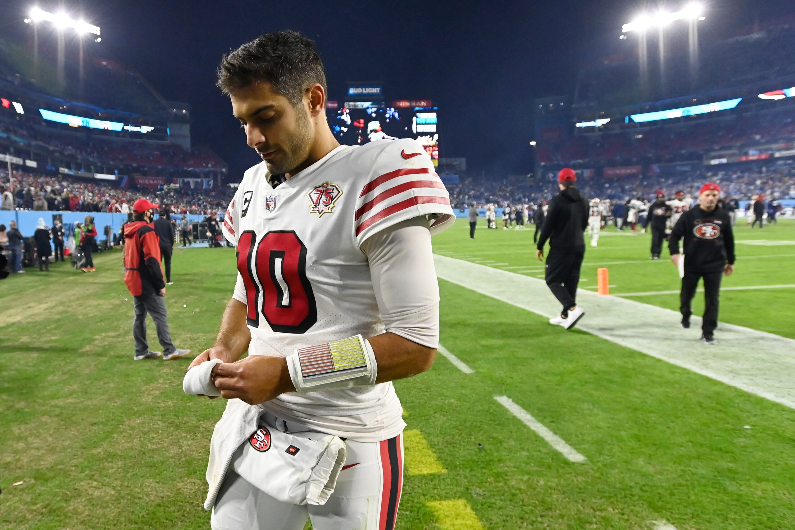 San Francisco 49ers quarterback Jimmy Garoppolo leaves the field after losing to the Tennessee Titans in an NFL football game Thursday, Dec. 23, 2021, in Nashville, Tenn. (AP Photo/Mark Zaleski) San Francisco 49ers quarterback Jimmy Garoppolo leaves the field after losing to the Tennessee Titans in an NFL football game Thursday, Dec. 23, 2021, in Nashville, Tenn. (AP Photo/Mark Zaleski)