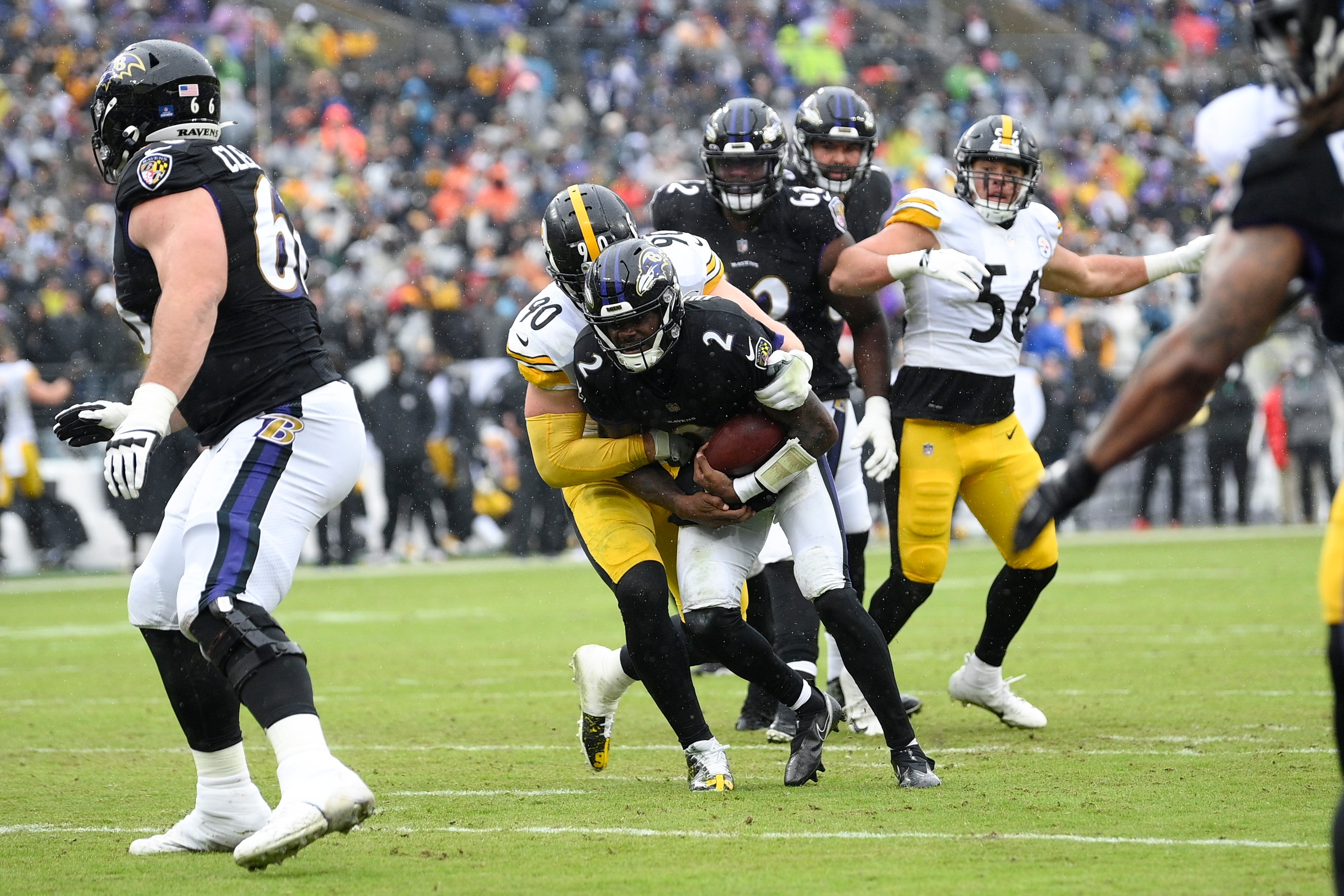 Pittsburgh Steelers outside linebacker T.J. Watt (90) sacks Baltimore Ravens quarterback Tyler Huntley during the first half of an NFL football game, Sunday, Jan. 9, 2022, in Baltimore. With the sack, Watt ties Hall of Famer Michael Strahan's single-season sack record of 22.5. (AP Photo/Nick Wass)