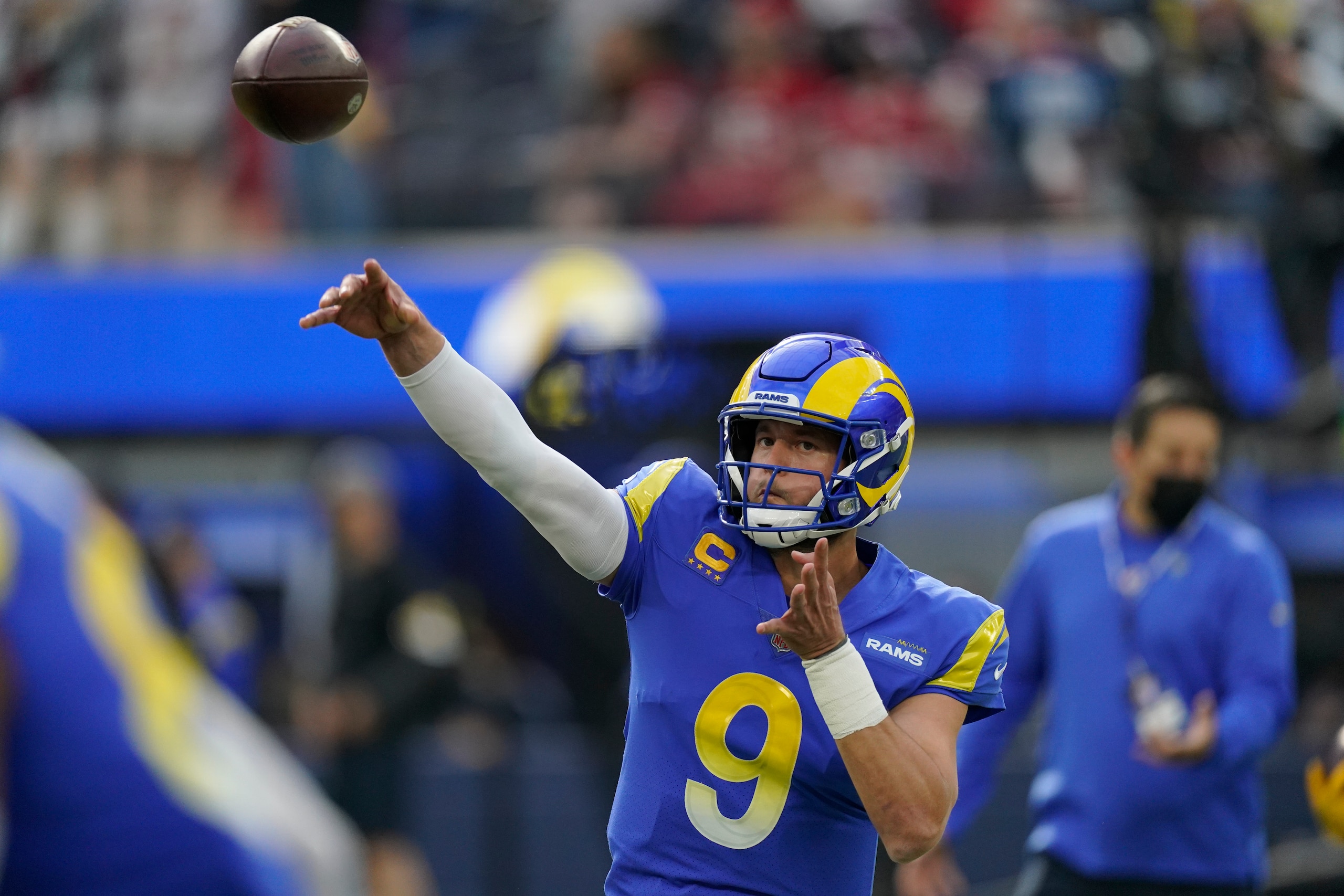 Los Angeles Rams quarterback Matthew Stafford (9) warms up before an NFL football game against the San Francisco 49ers Sunday, Jan. 9, 2022, in Inglewood, Calif. (AP Photo/Mark J. Terrill)