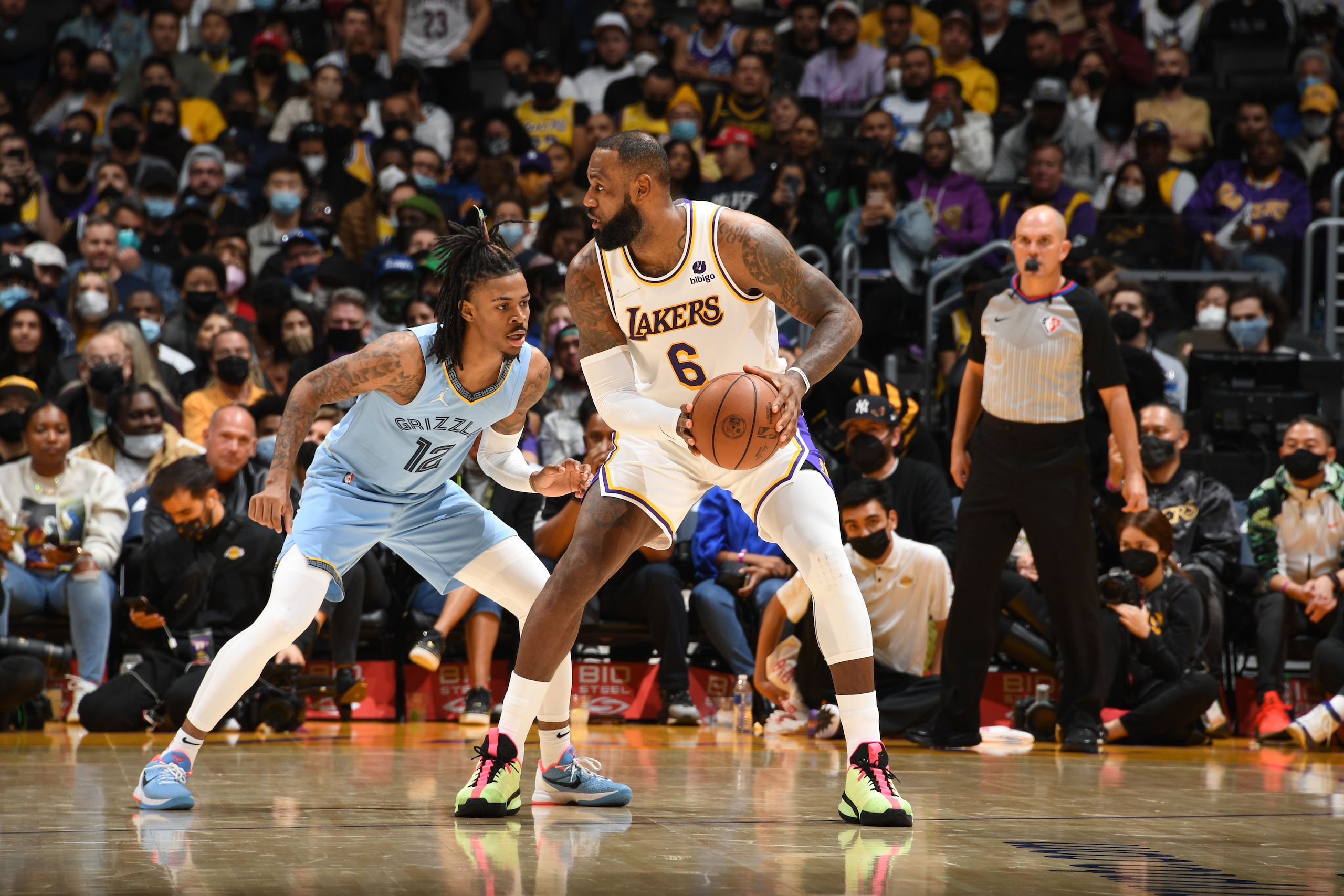 LOS ANGELES, CA - JANUARY 9: Ja Morant #12 of the Memphis Grizzlies plays defense on LeBron James #6 of the Los Angeles Lakers during the game on January 9, 2022 at Crypto.Com Arena in Los Angeles, California. NOTE TO USER: User expressly acknowledges and agrees that, by downloading and/or using this Photograph, user is consenting to the terms and conditions of the Getty Images License Agreement. Mandatory Copyright Notice: Copyright 2021 NBAE (Photo by Andrew D. Bernstein/NBAE via Getty Images)
