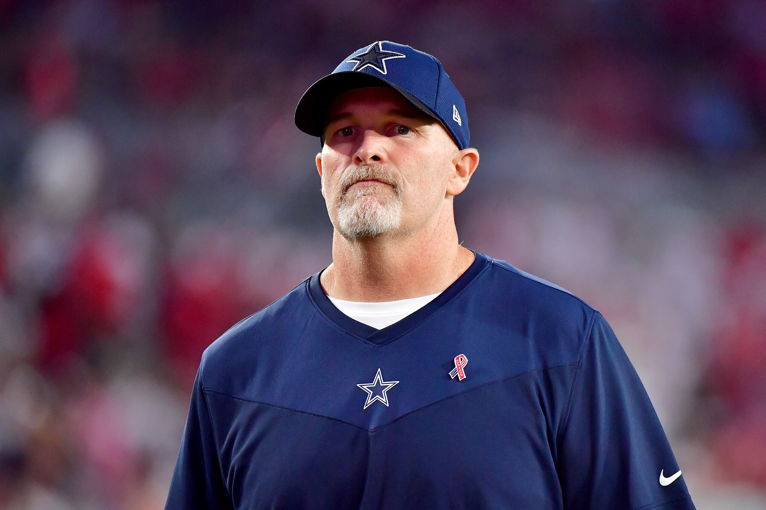 TAMPA, FLORIDA - SEPTEMBER 09: Defensive coordinator Dan Quinn of the Dallas Cowboys looks on before the game against the Tampa Bay Buccaneers at Raymond James Stadium on September 09, 2021 in Tampa, Florida. (Photo by Julio Aguilar/Getty Images) TAMPA, FLORIDA - SEPTEMBER 09: Defensive coordinator Dan Quinn of the Dallas Cowboys looks on before the game against the Tampa Bay Buccaneers at Raymond James Stadium on September 09, 2021 in Tampa, Florida. (Photo by Julio Aguilar/Getty Images)